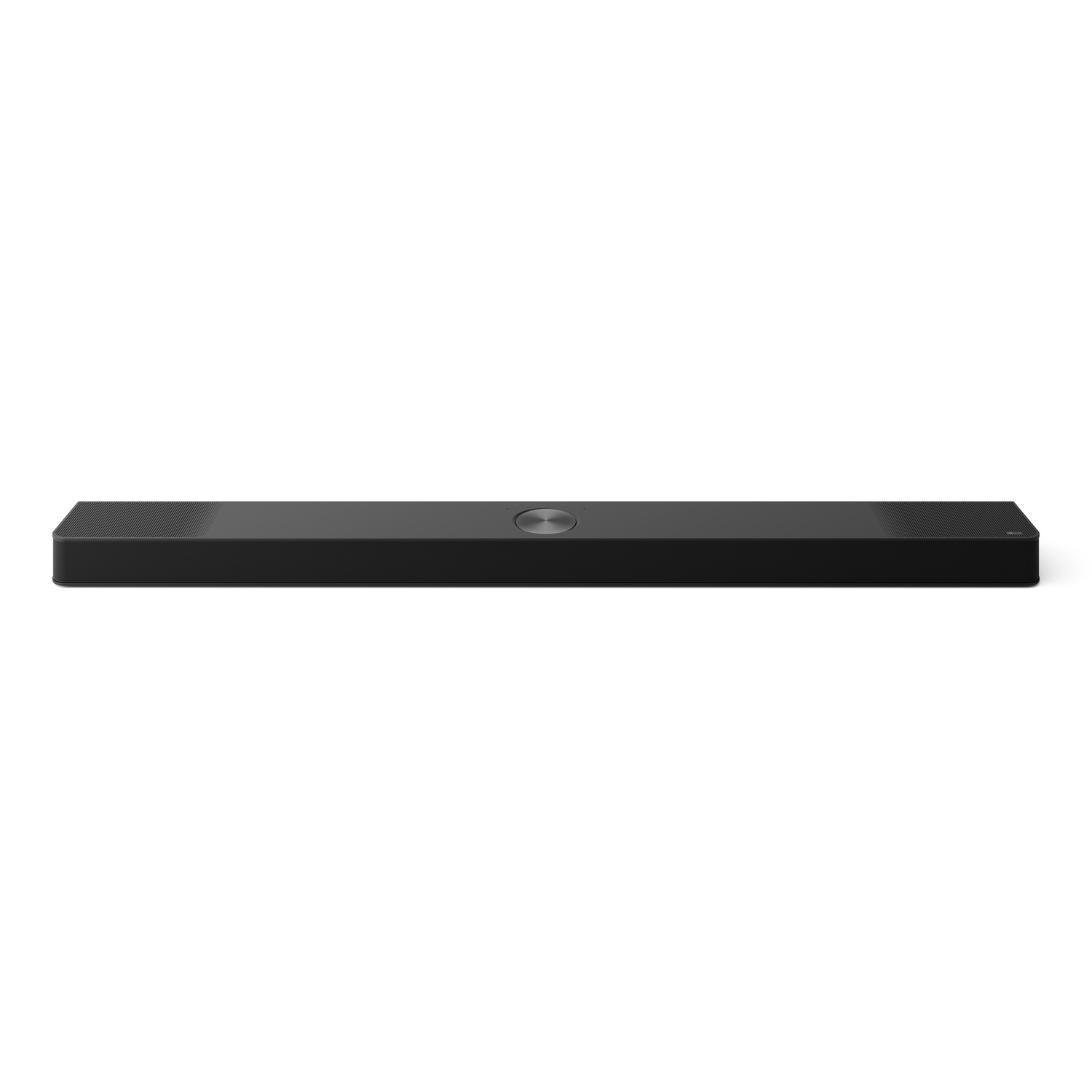 Black soundbar, rectangular shape, with a central silver button, placed on a white surface.