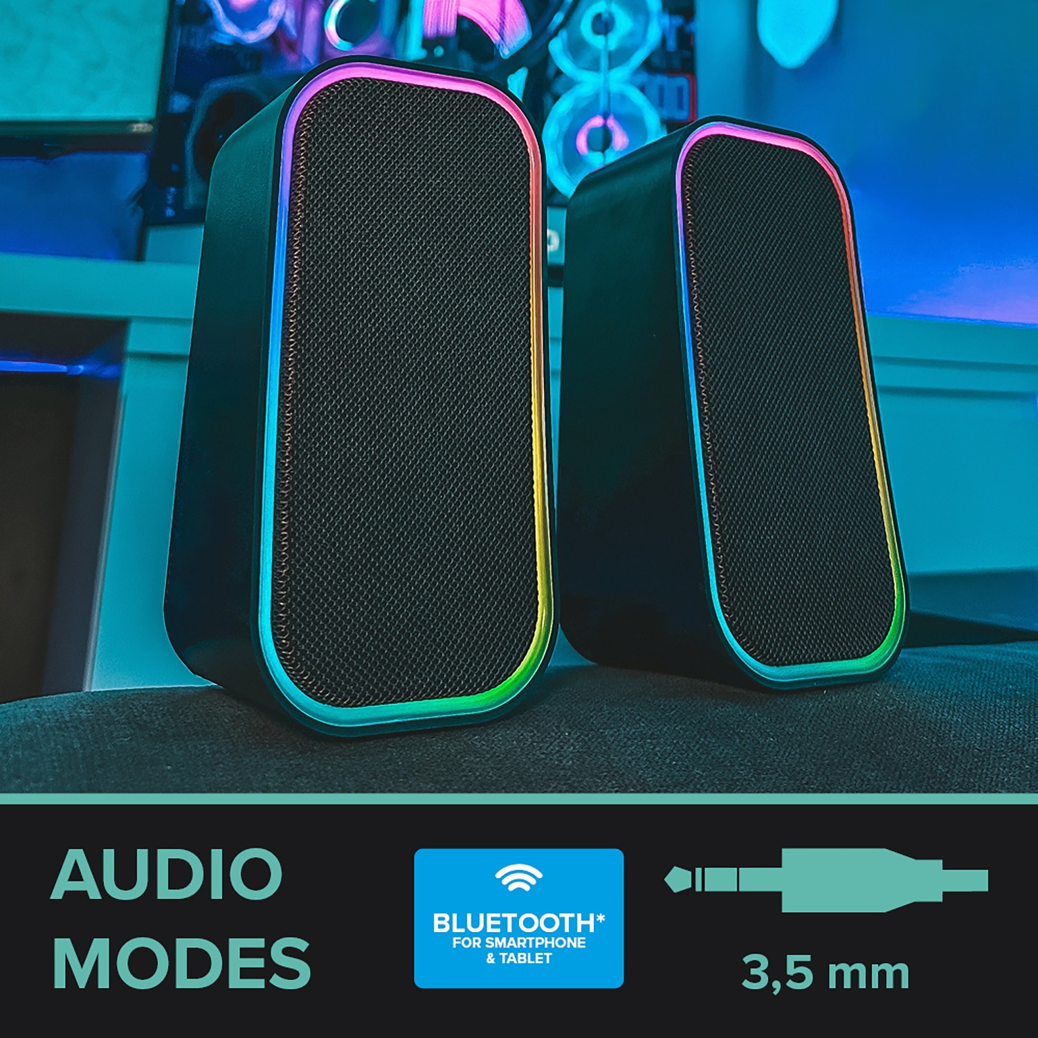 Zwei schwarze Lautsprecher mit bunten Lichtakzenten, mit Audiomodus-Symbolen.