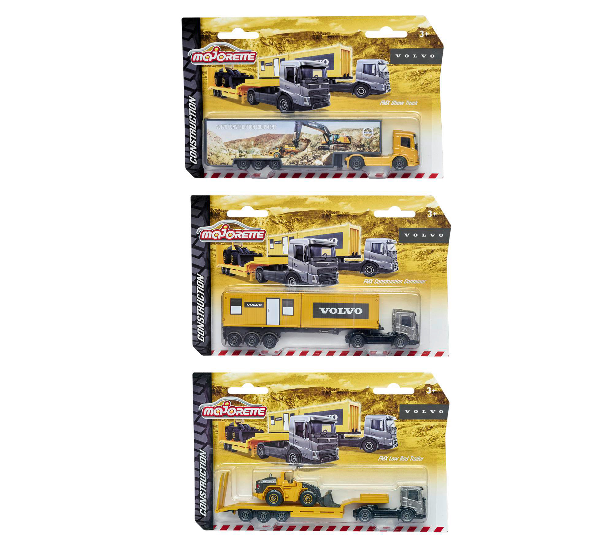 Drei Spielzeug-LKW-Verpackungen gestapelt, je mit Volvo-Modell.