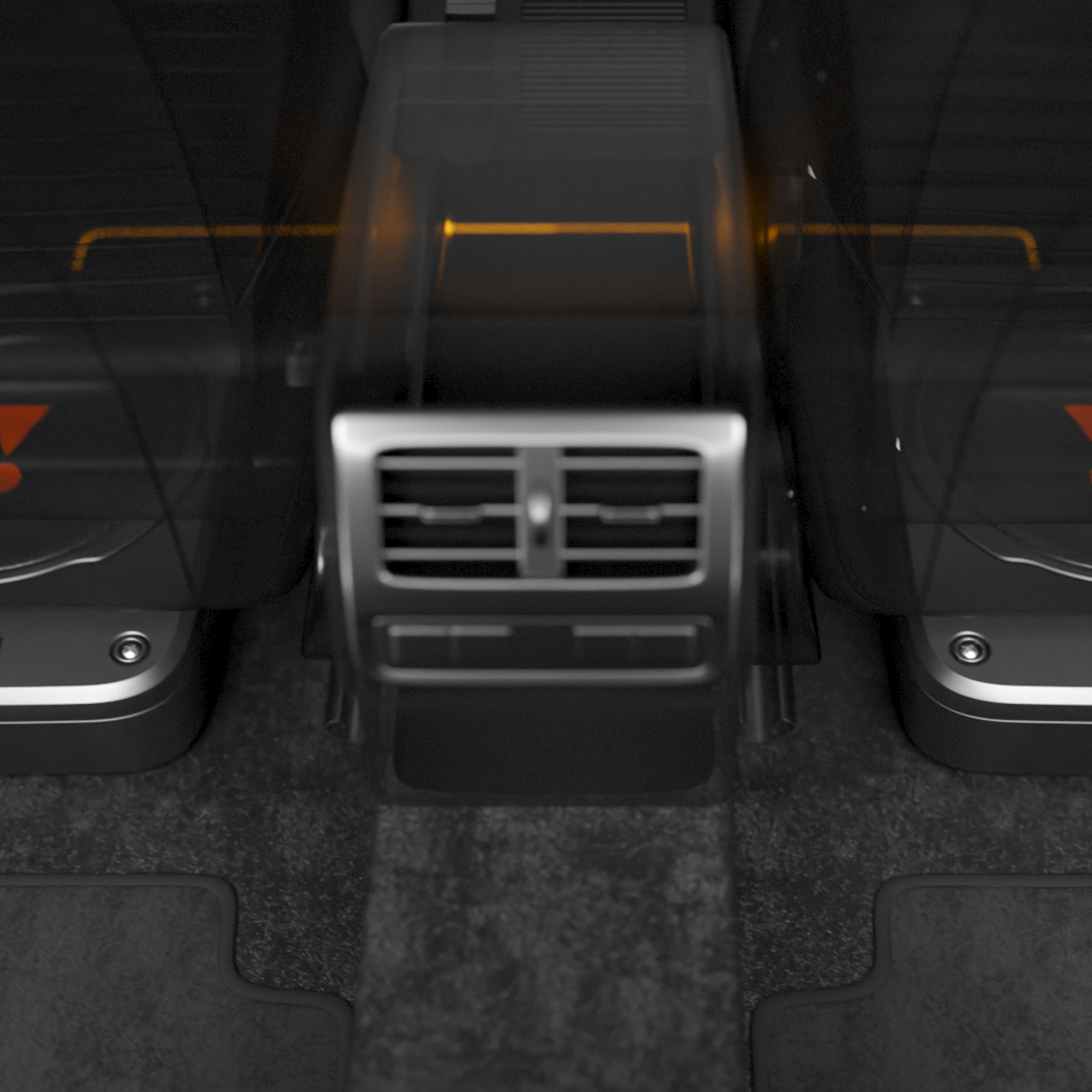 Interieur van de auto: Achterbanken, ventilatieopeningen en vloermatten. Donkere kleuren, focus op details.