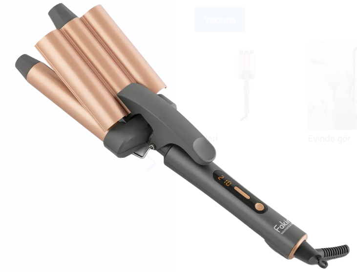 Gri ve pembe altın rengi bir saç dalgalandırıcı. Beyaz bir arka plan üzerinde.