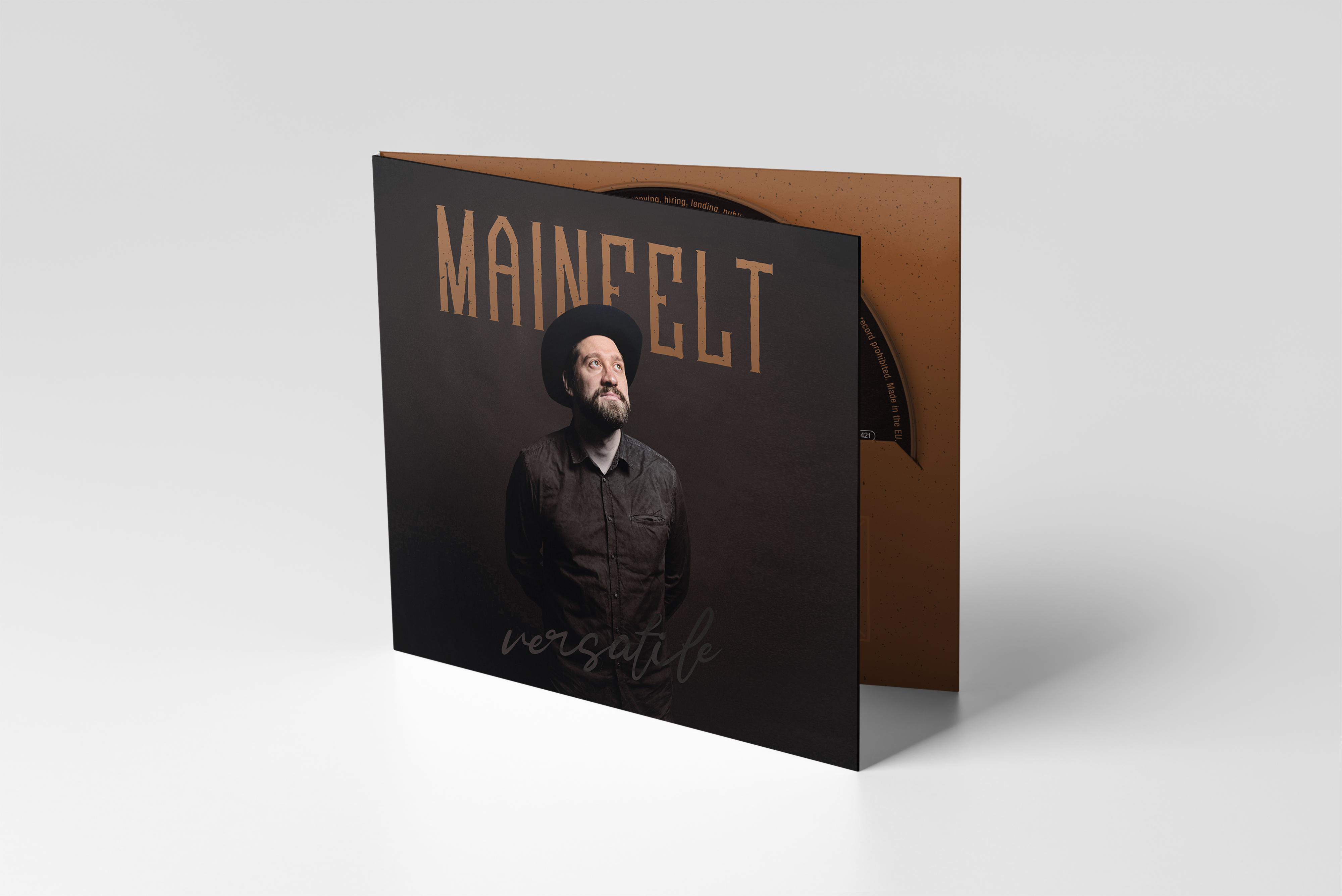 Eine CD-Hülle für den Musikkünstler 'Mainfelt', geöffnet vor weißem Hintergrund.