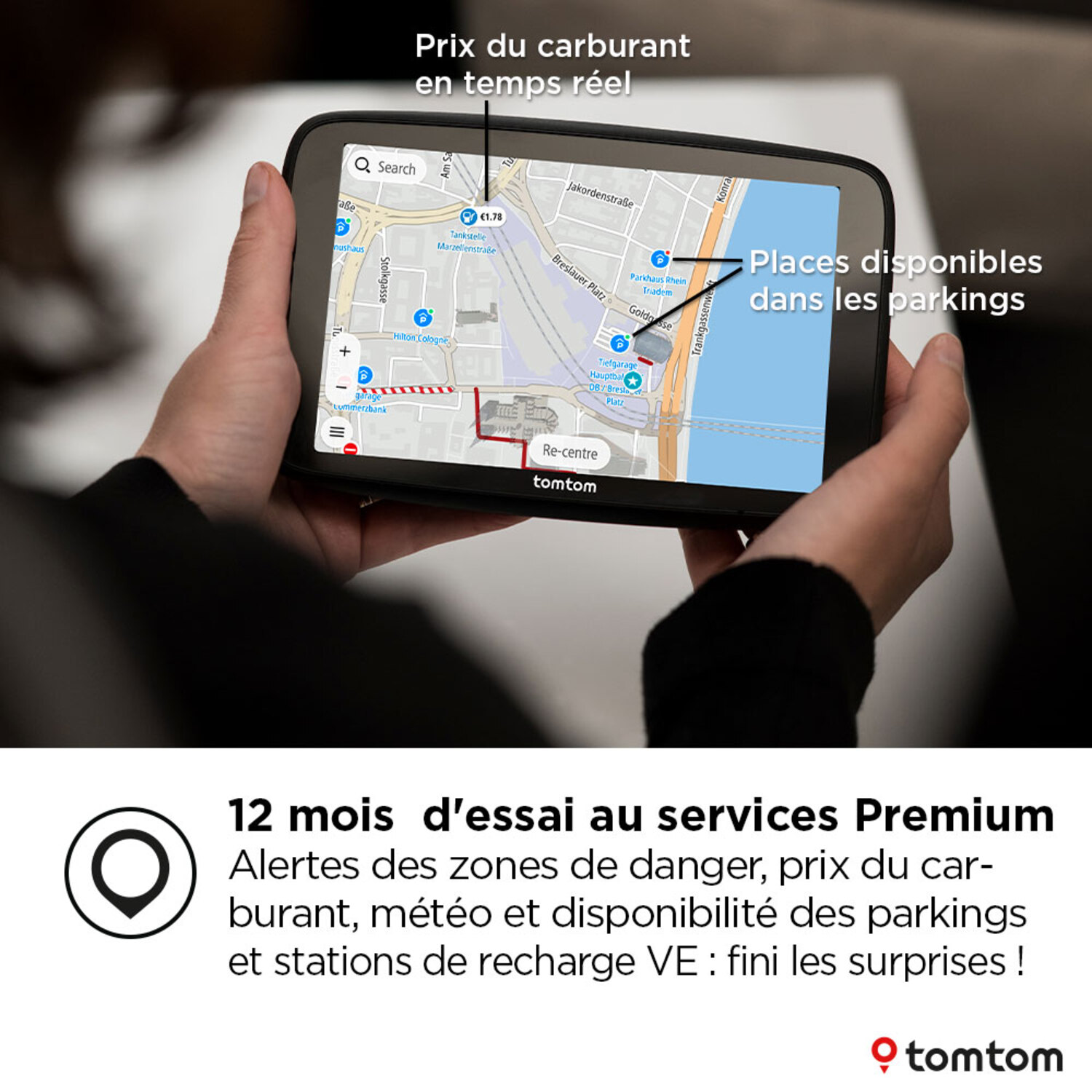 Un appareil GPS TomTom affichant une carte et les prix du carburant, texte en français.