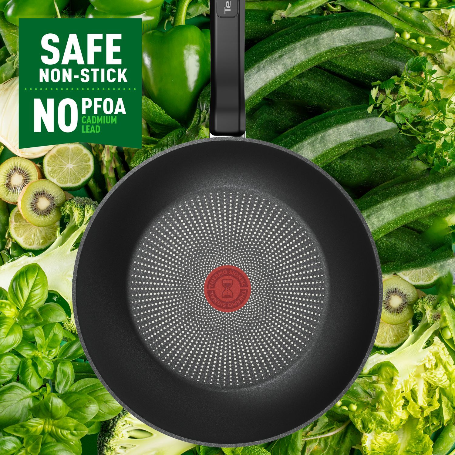 Black frying pan with vegetables around it. Text on the left says 'Safe Non-Stick'.
