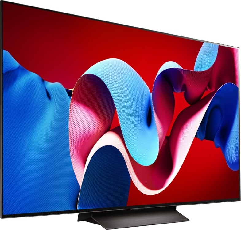 Ein Fernseher mit farbenfroher Bildschirmanzeige vor rotem und blauem Hintergrund.