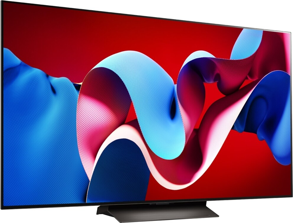 TV con un design astratto vibrante sullo schermo, su sfondo rosso.