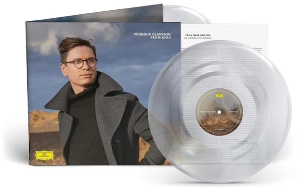 Albumcover mit einem Mann mit Brille, einer Schallplatte und der Rückseite.