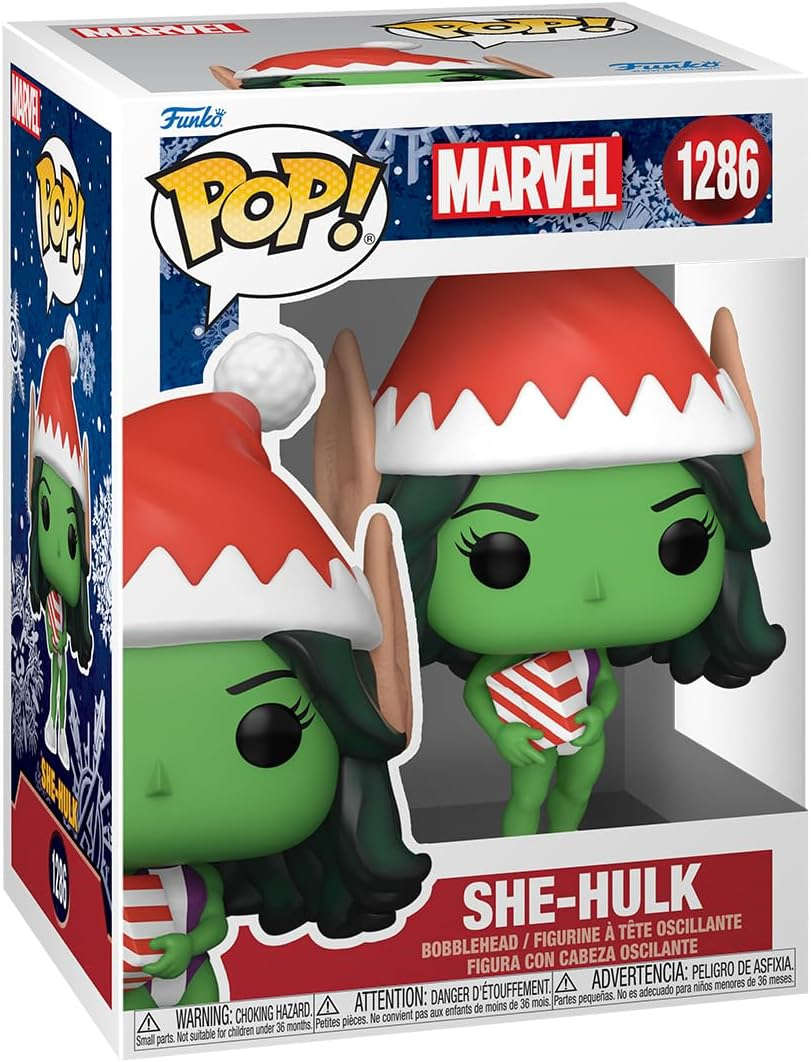 Dobozos She-Hulk Funko Pop figurák. Mikulás sapkát és csíkos felsőt visel, zöld bőrrel.