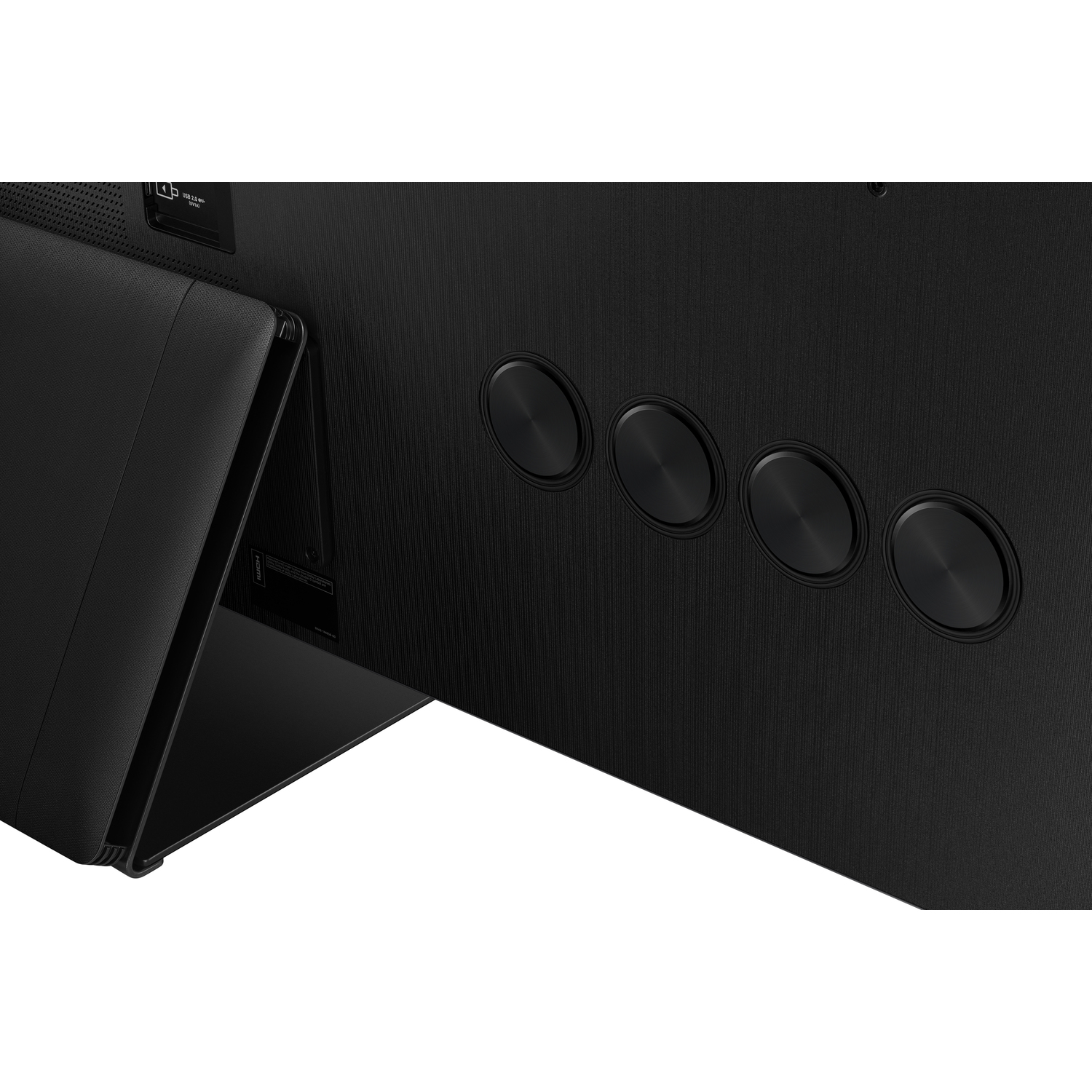 Gros plan d'une TV noire avec quatre boutons circulaires sur le côté, panneau noir.
