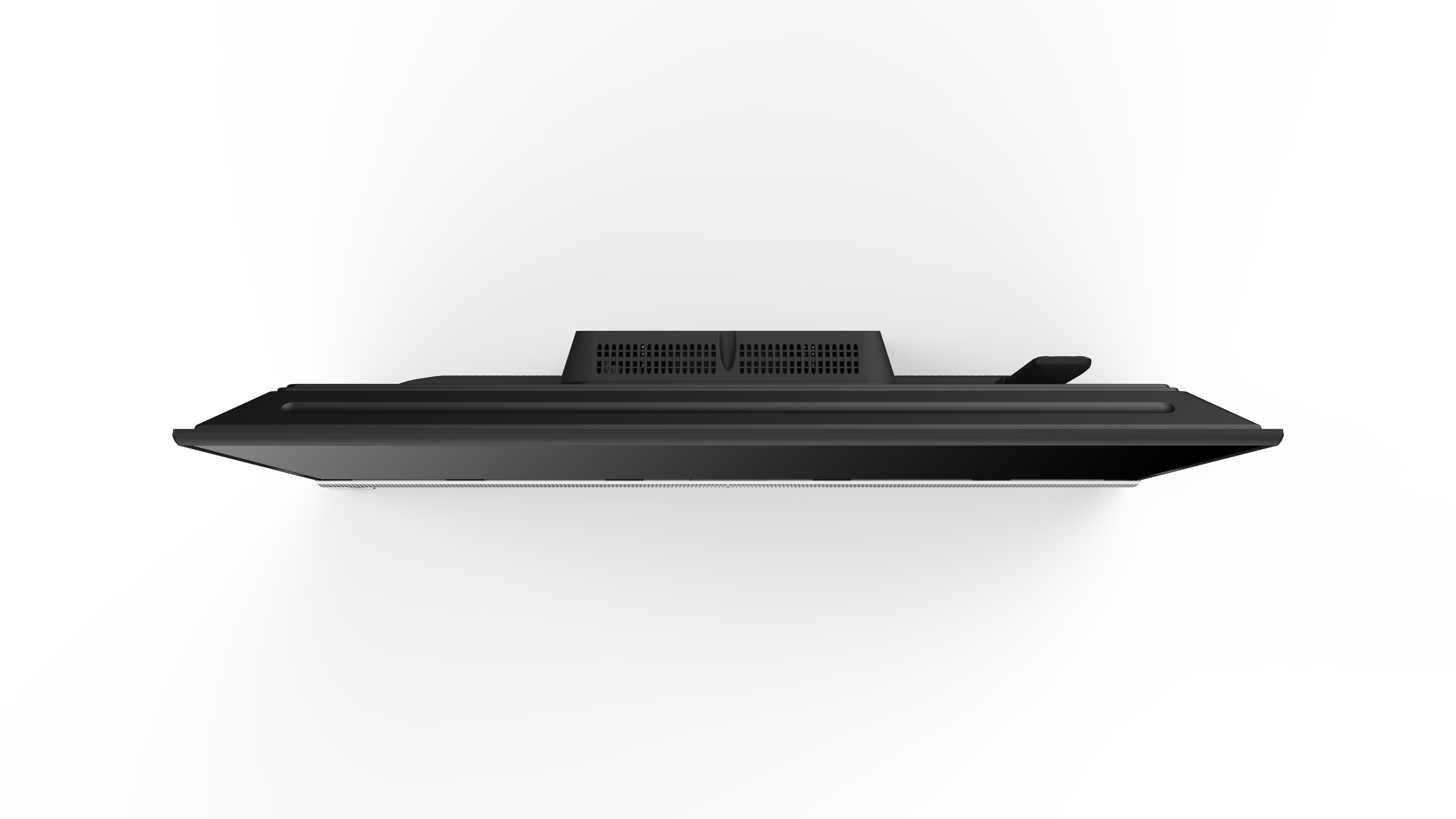 Draufsicht auf einen schwarzen Fernseher mit Lüftungsschlitzen und Anschlüssen, ein schlankes, flaches Design.