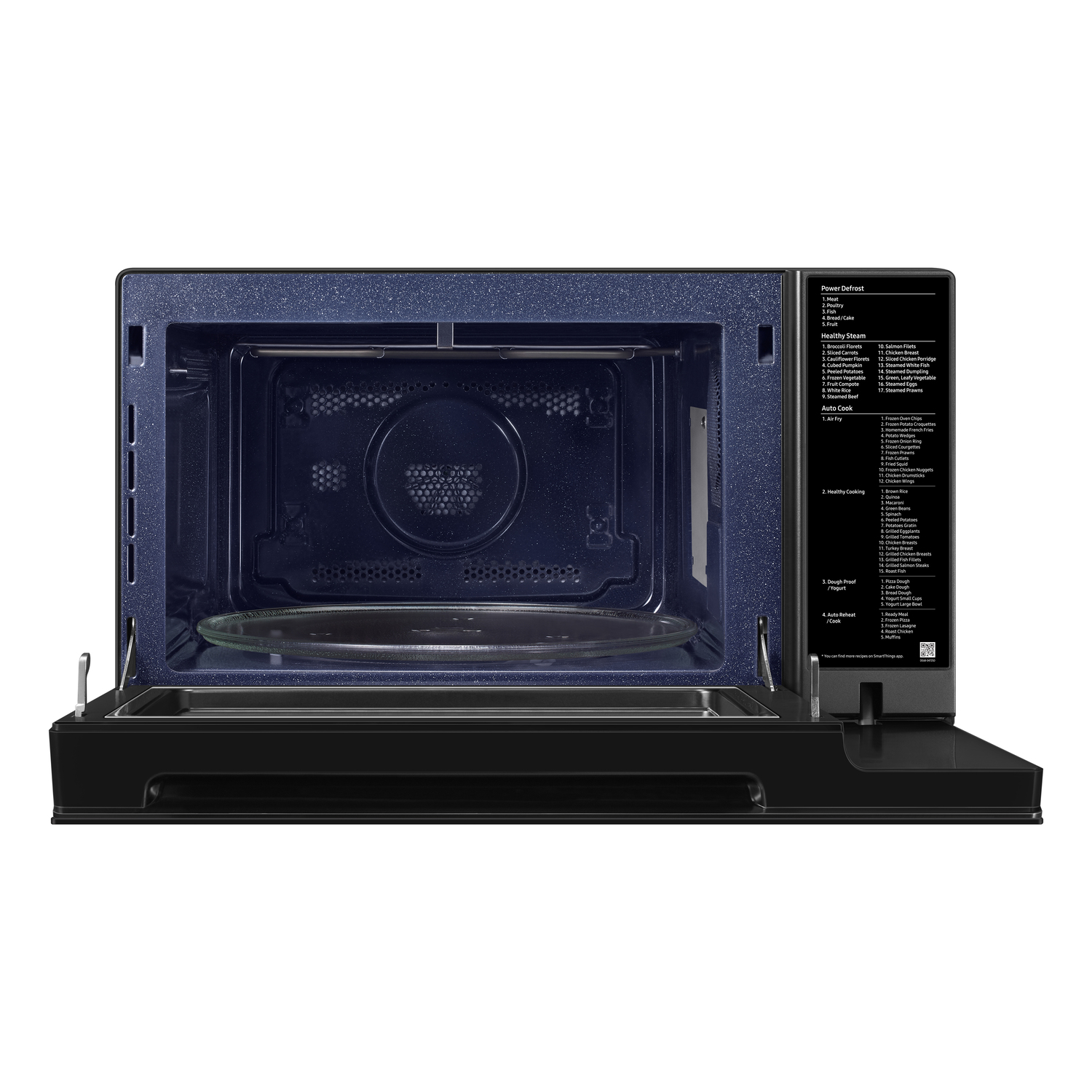 Interior of a microwave oven with open door, glass plate, and control panel.