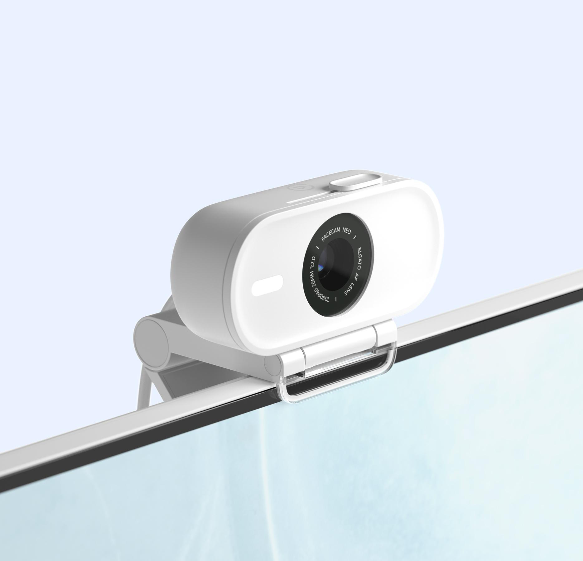 Weiße Webcam auf einem Monitor, abgewinkelt. Sie hat eine Kameralinse in der Mitte.