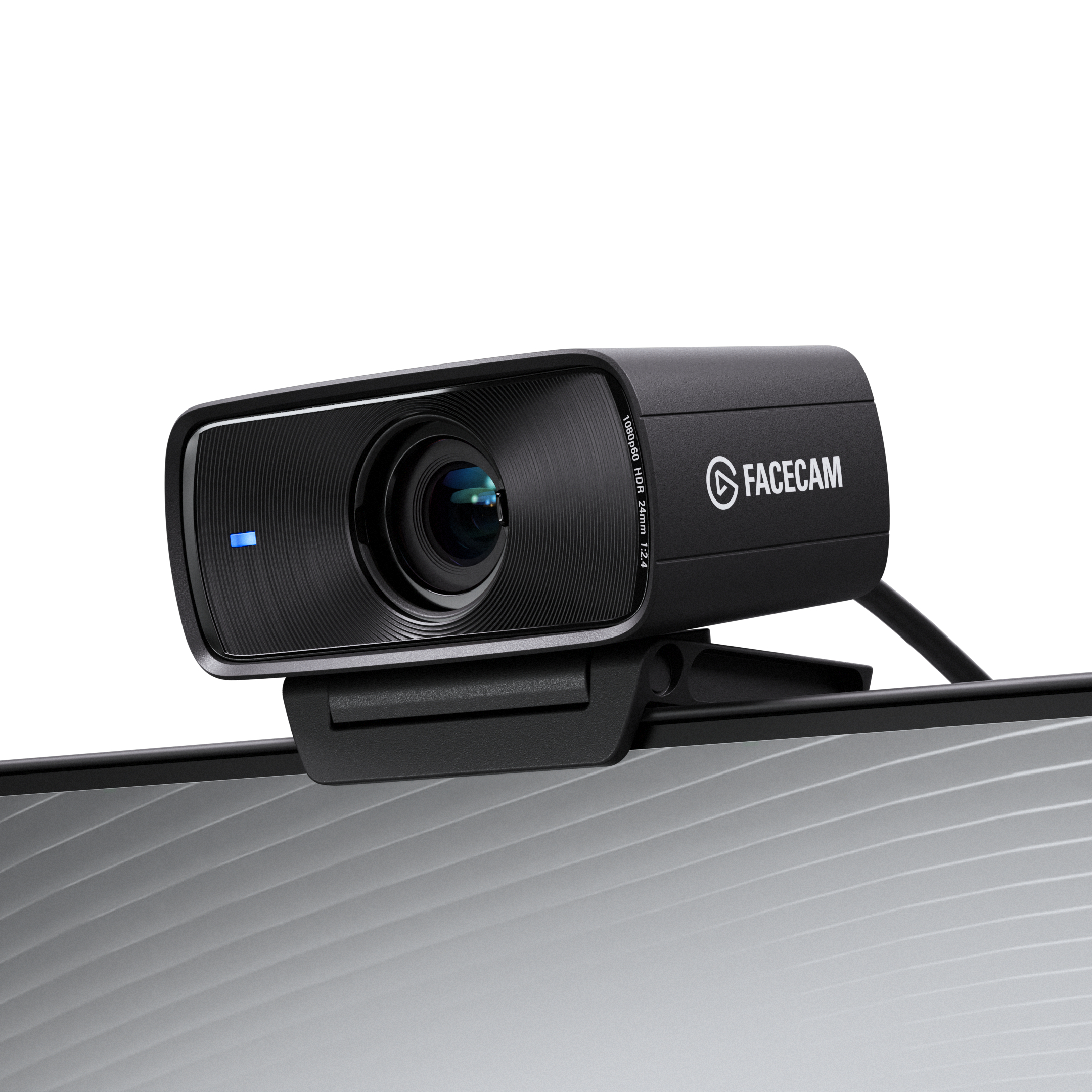 Eine schwarze Facecam-Webcam auf einem Monitor. Sie hat ein Objektiv, ein Licht und das Facecam-Logo.