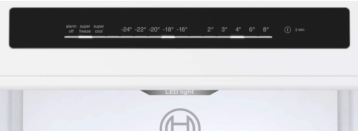 White refrigerator control panel showing temperature settings and LED light indicator.