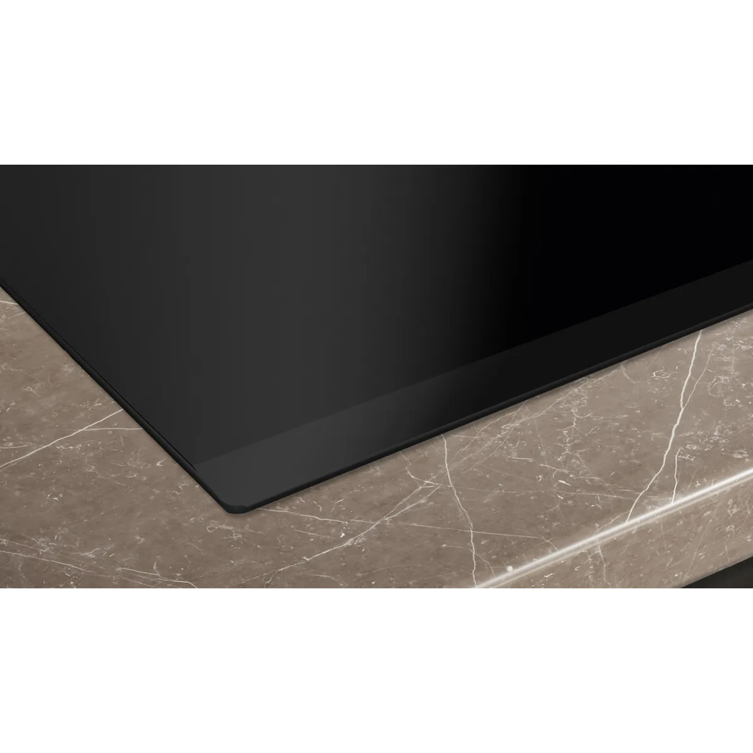 A black stovetop on a brown countertop. The stovetop is a smooth, black surface.