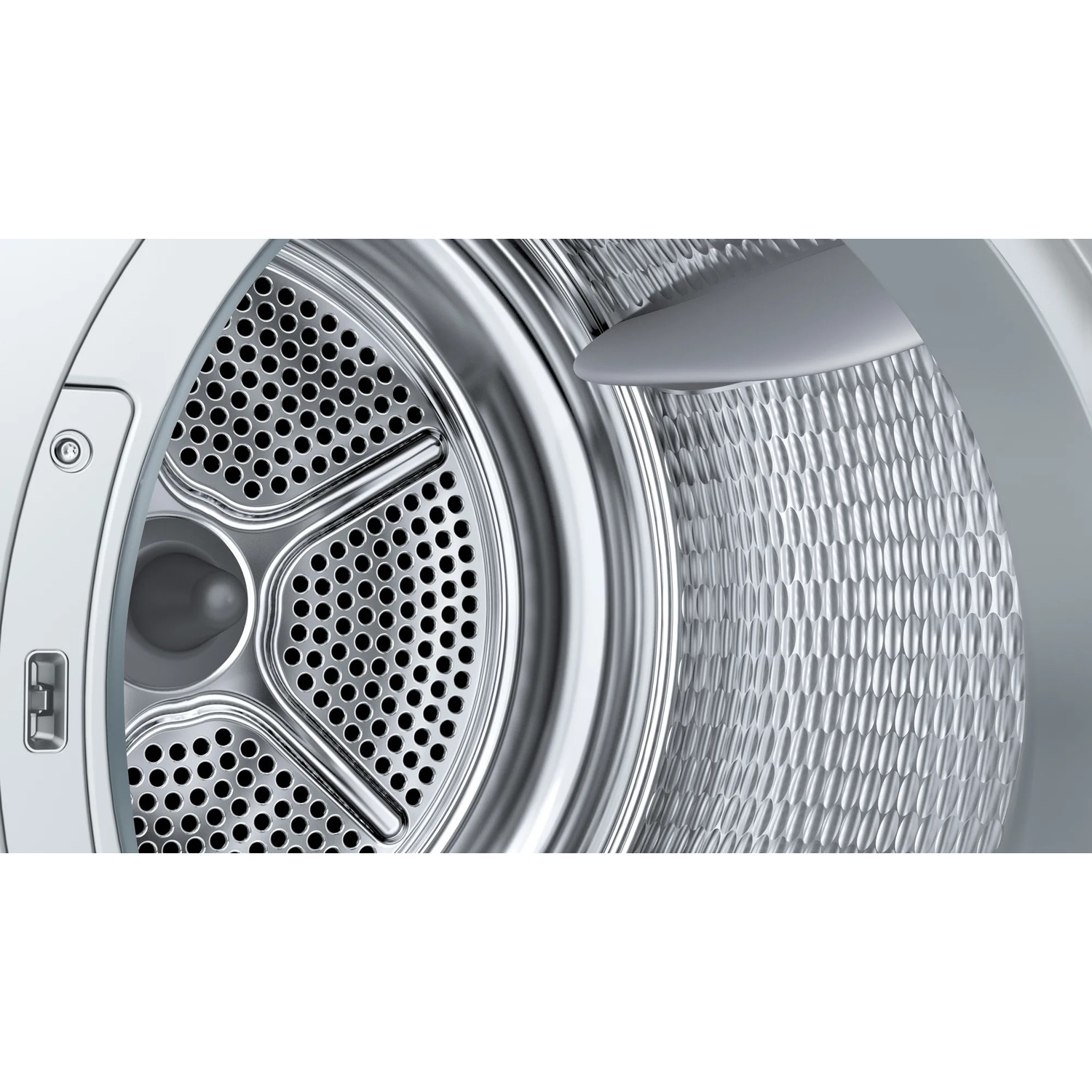Close-up of a washing machine drum interior. Shiny metal with holes and a textured back panel is visible.