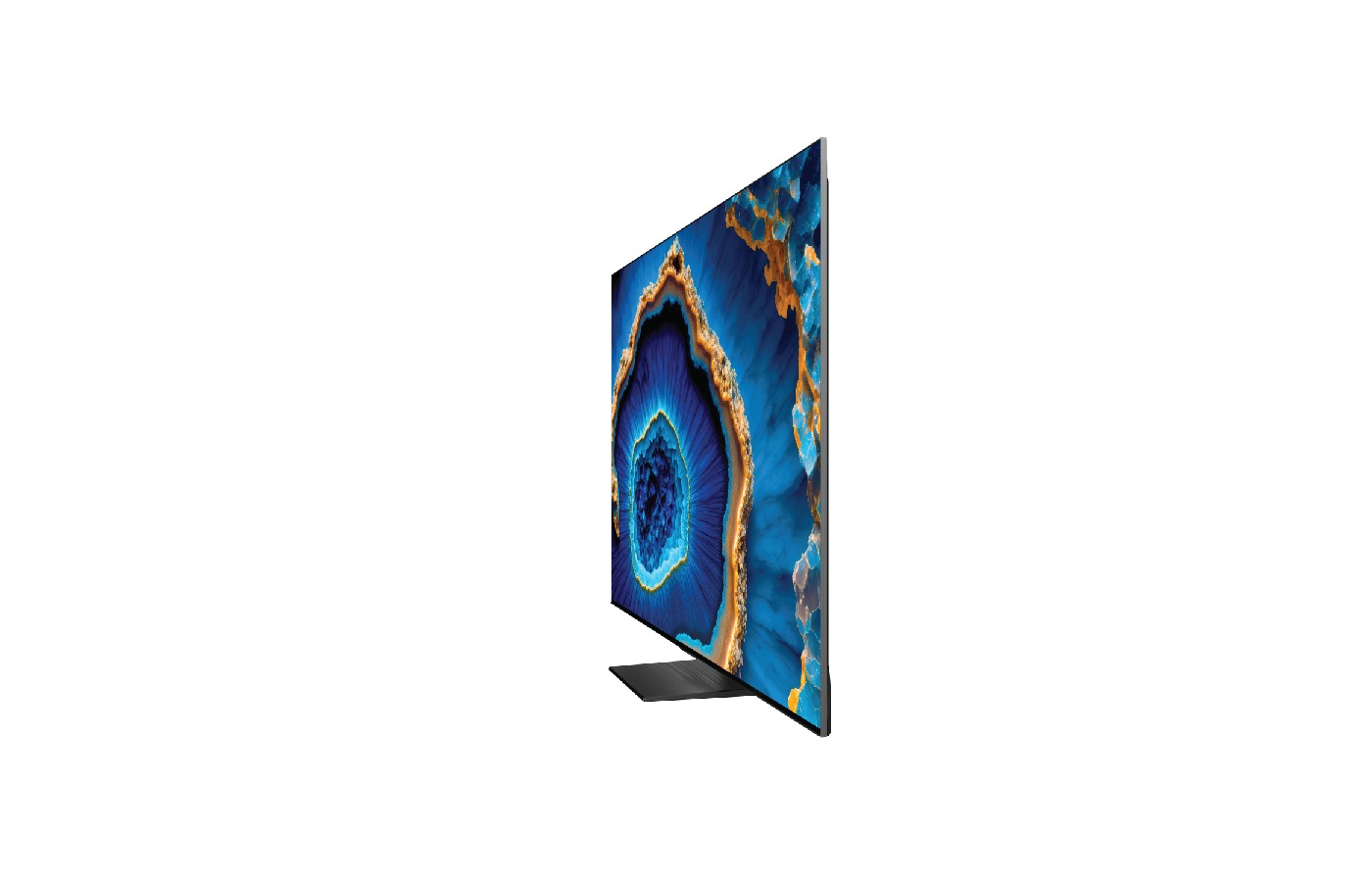 TV, yan görünüm. Ekran mavi ve altın soyut bir desen gösteriyor. Siyah bir standı var.
