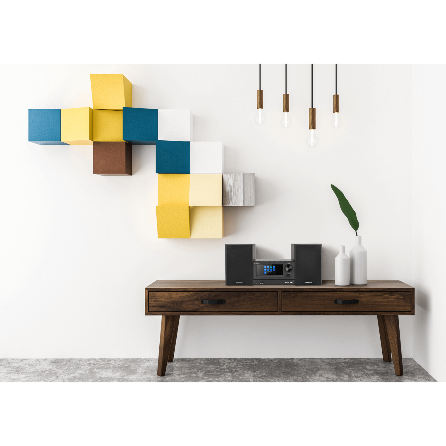 A wooden cabinet with a stereo system, and colorful wall decor, with hanging lights.