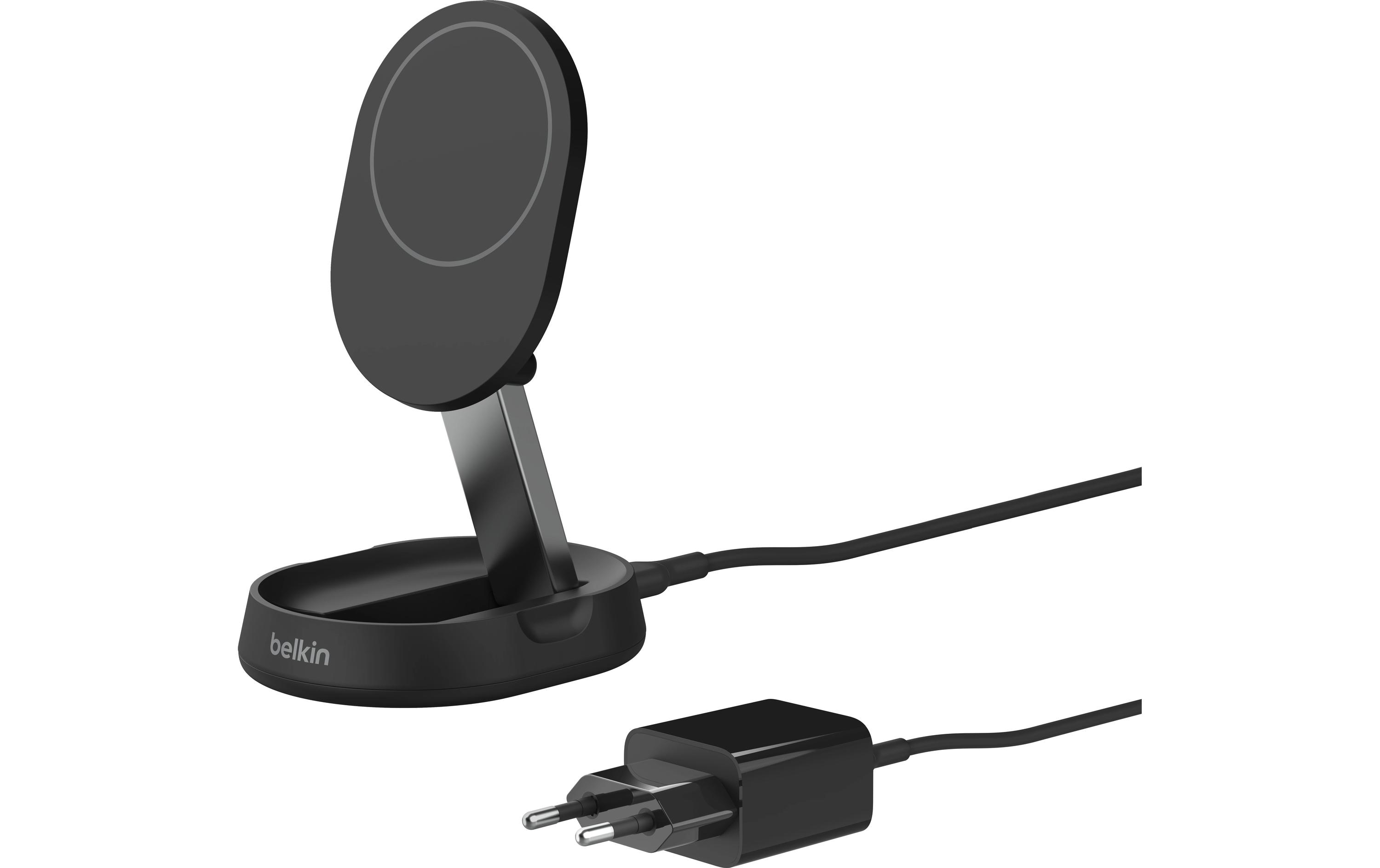 Support de charge sans fil noir avec téléphone, connecté à un adaptateur secteur.