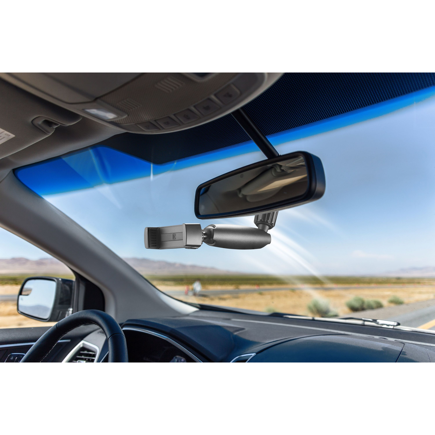 Auto-interieur met een dashcam en achteruitkijkspiegel.