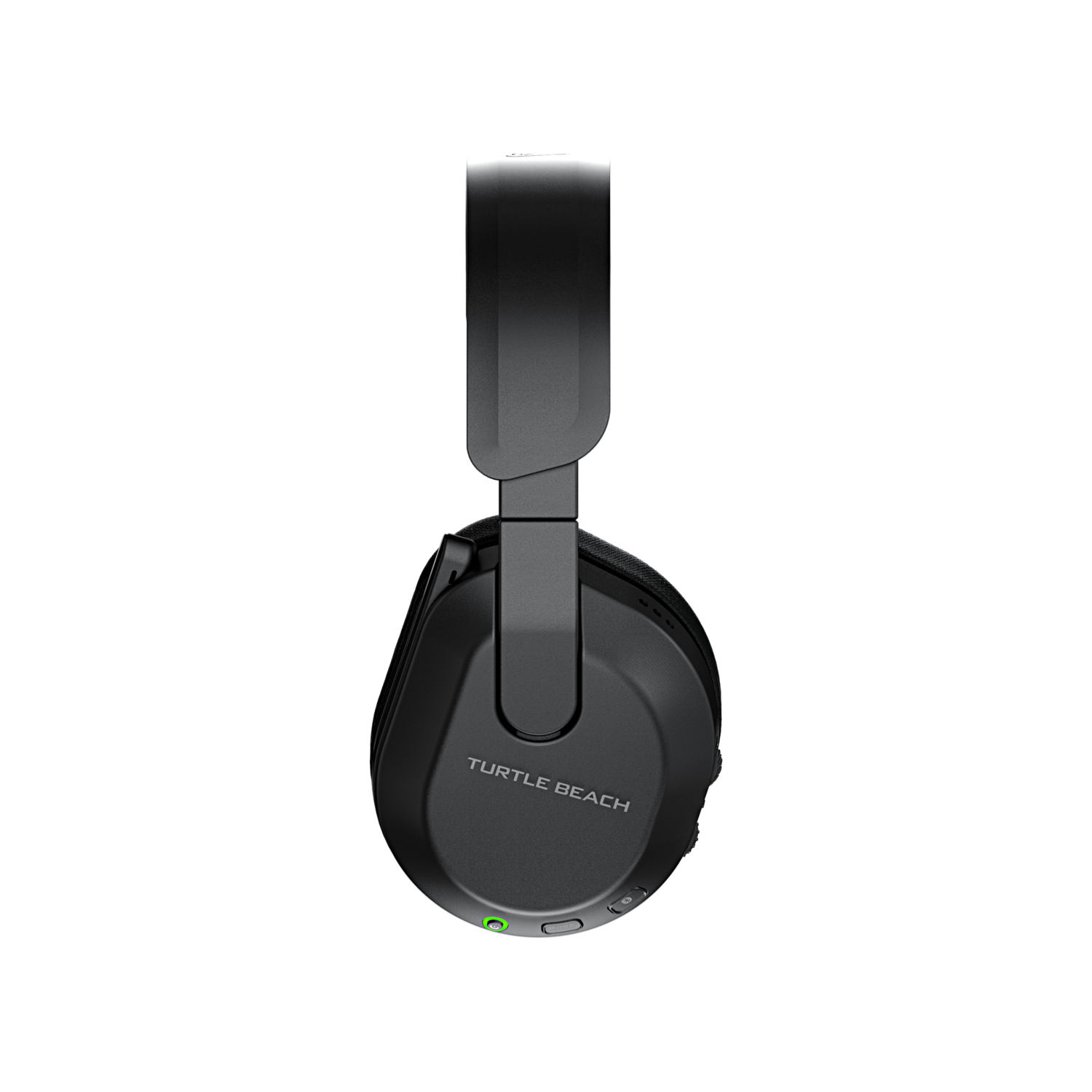 Casque Turtle Beach noir. Vue de côté, isolé sur fond noir. Lumière verte près du bouton d'alimentation.
