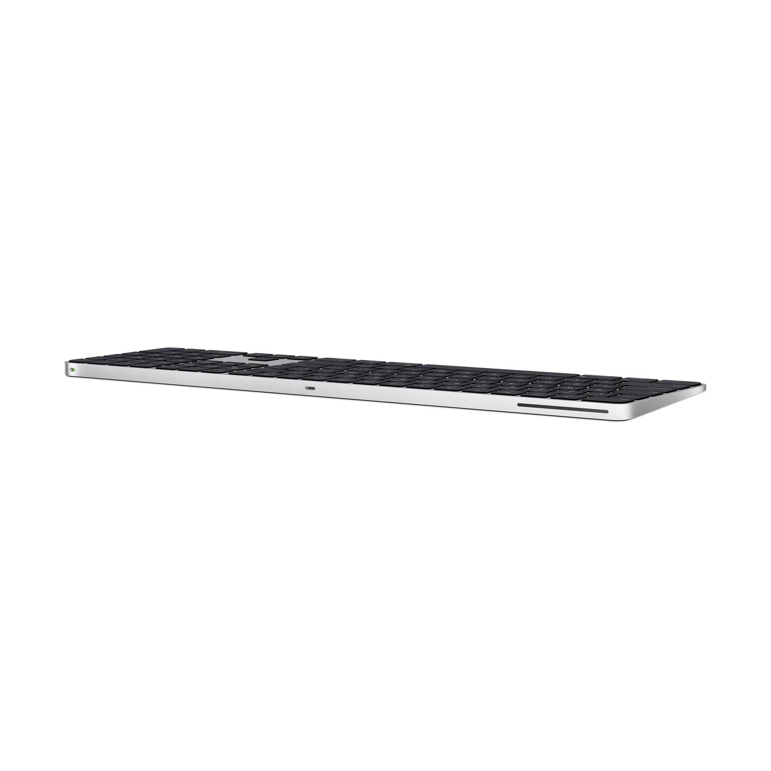 A silver and black Apple Magic Keyboard, side view, with the keys and charging port visible.