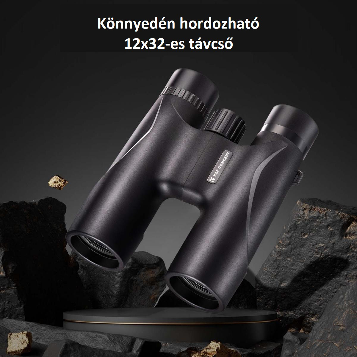 Fekete távcső sötét felületen. A szöveg 12x32-t ír. A háttér sötét, sziklás felület.