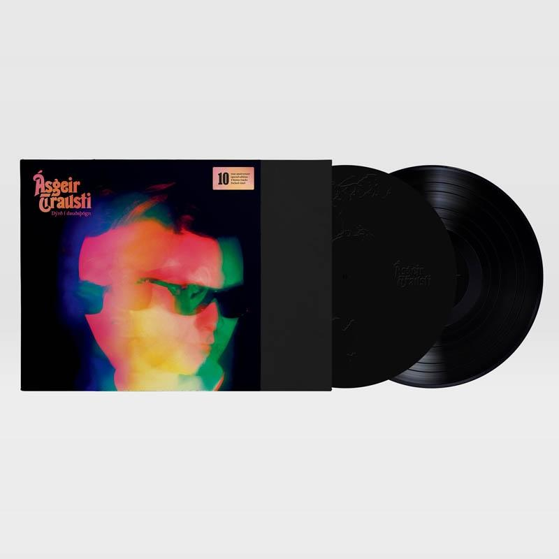 Vinylplatte mit Cover-Art, die ein buntes, verschwommenes Bild eines Männergesichts zeigt.