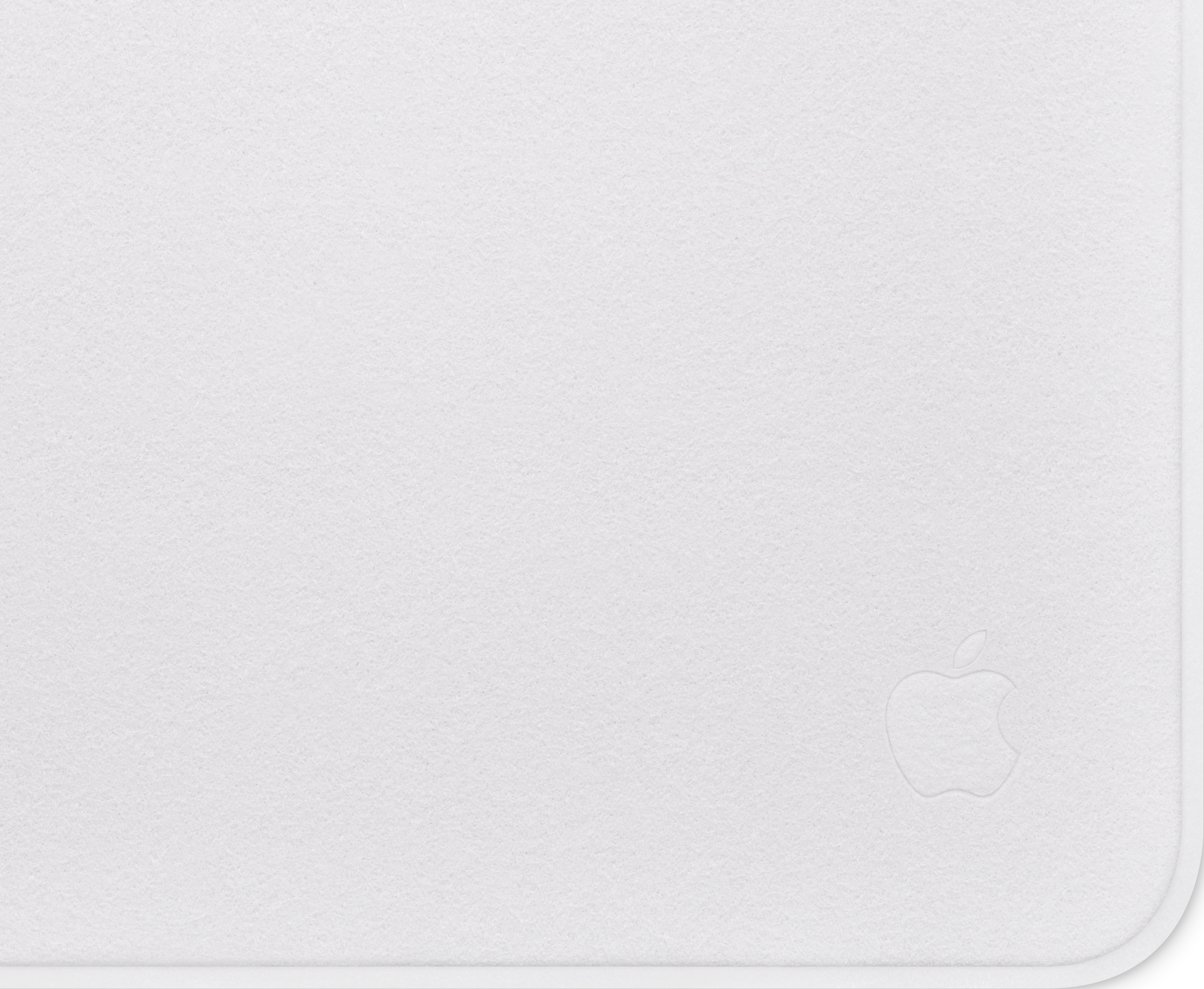 Weiße, matte Oberfläche mit einem dezenten Apple-Logo, das in der unteren rechten Ecke geprägt ist.