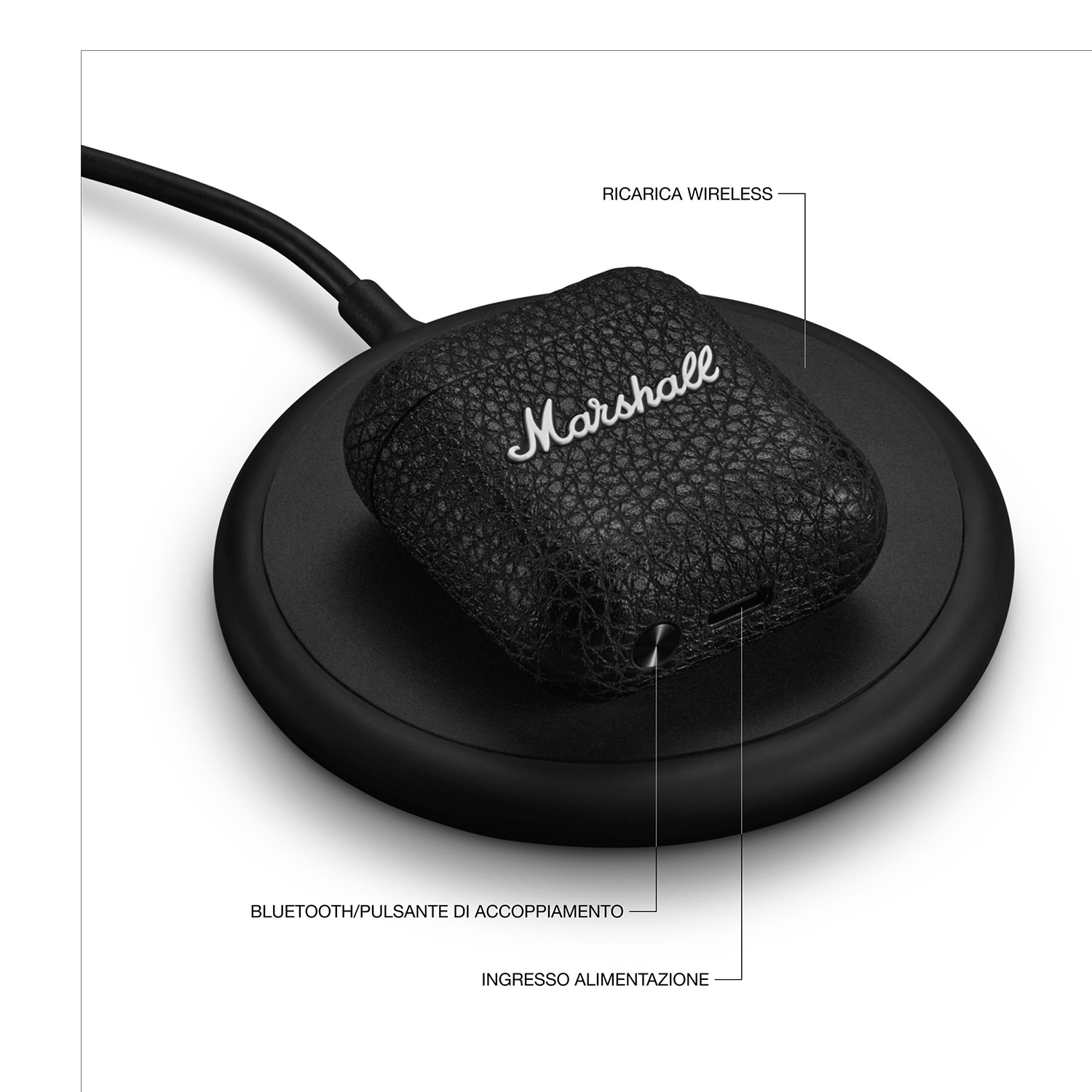 Un caricatore wireless nero con una custodia per auricolari Marshall nera.