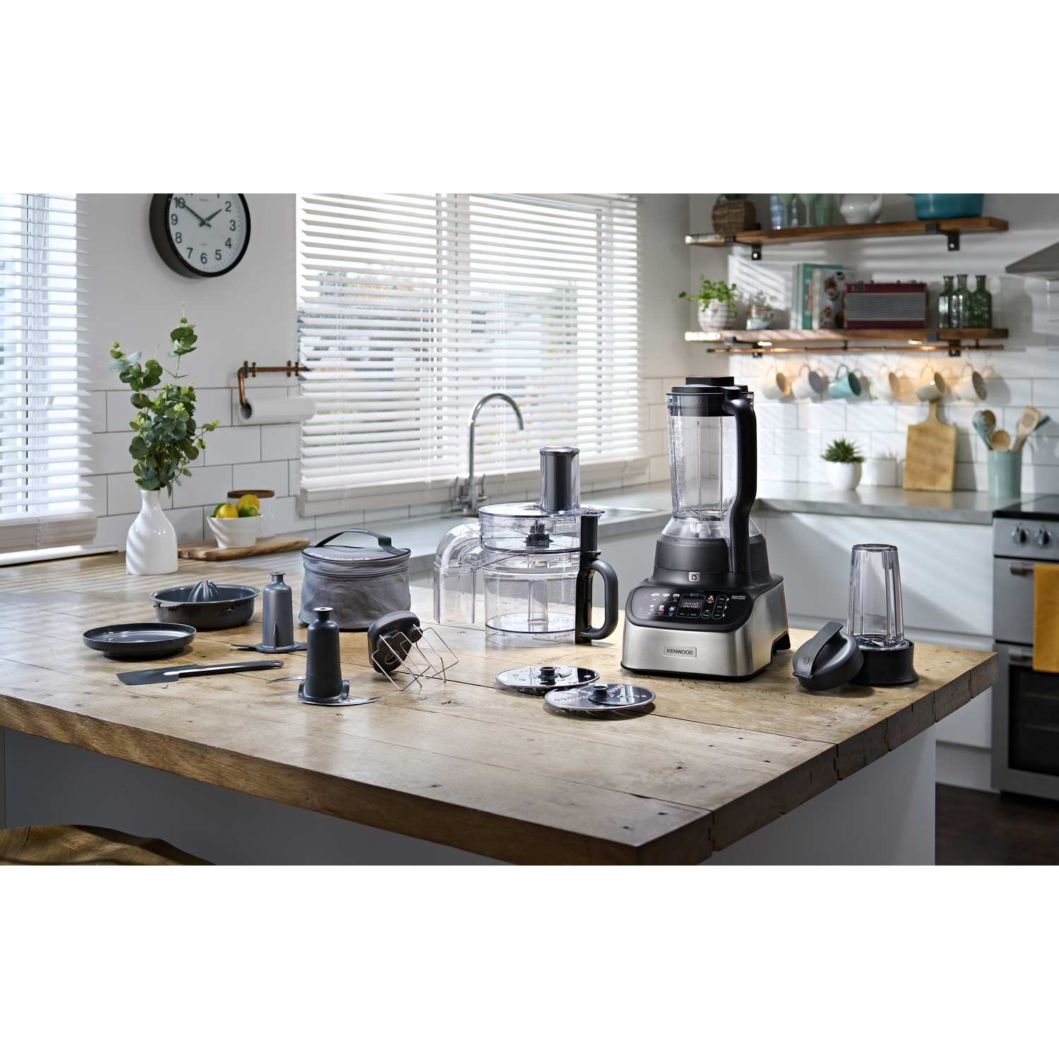 Kitchen countertop with a Kenwood food processor and accessories.