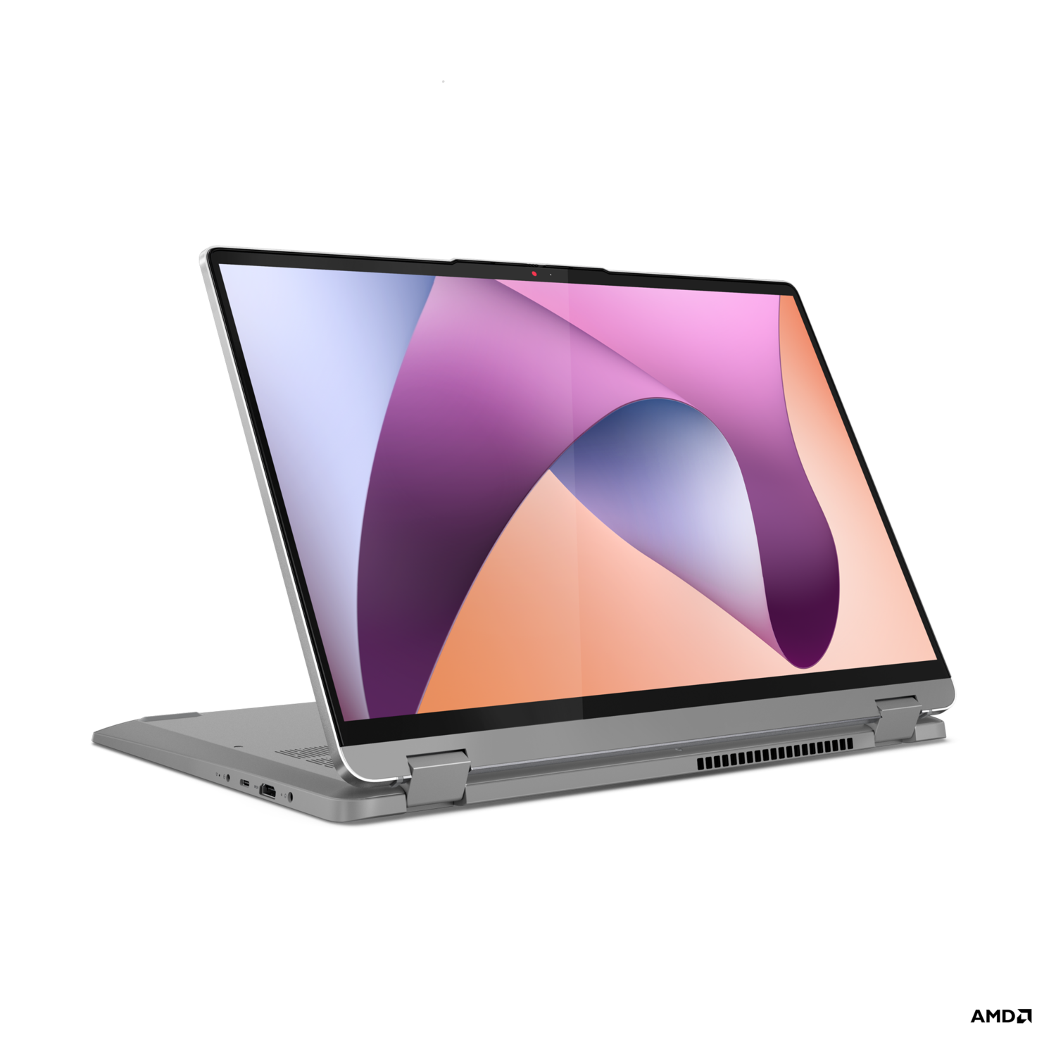 A silver laptop on a black background, with the screen open.