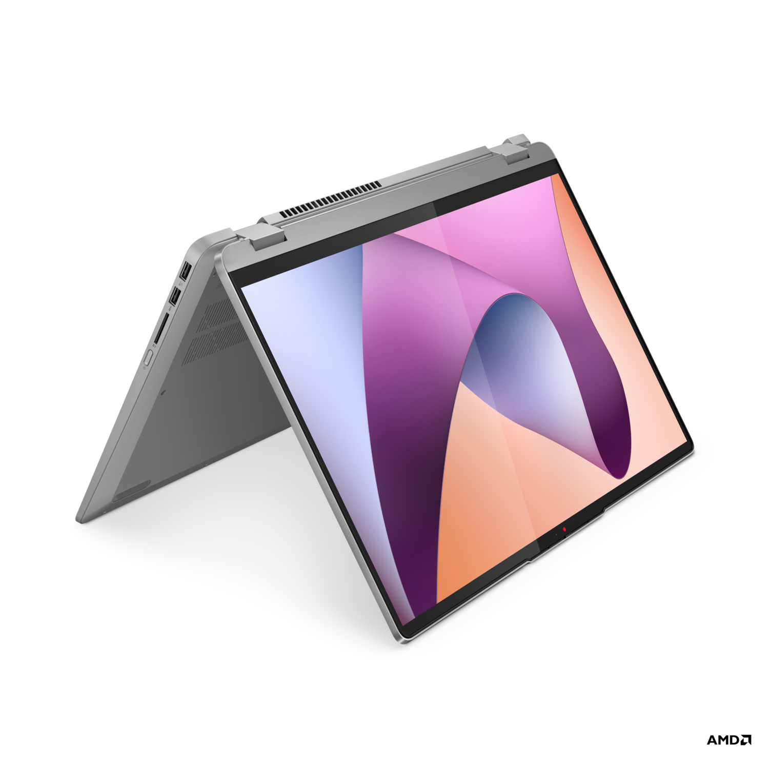 Silver laptop with a colorful screen, open at an angle, on a black background.