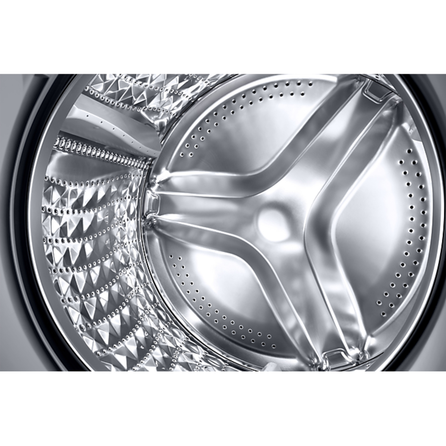Close-up of a washing machine drum. The interior is silver, with a central agitator and many small holes.