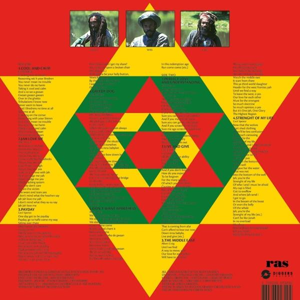 Eine Schallplatte mit Albumcover, das ein rot-gelb-grünes Design mit Text zeigt.