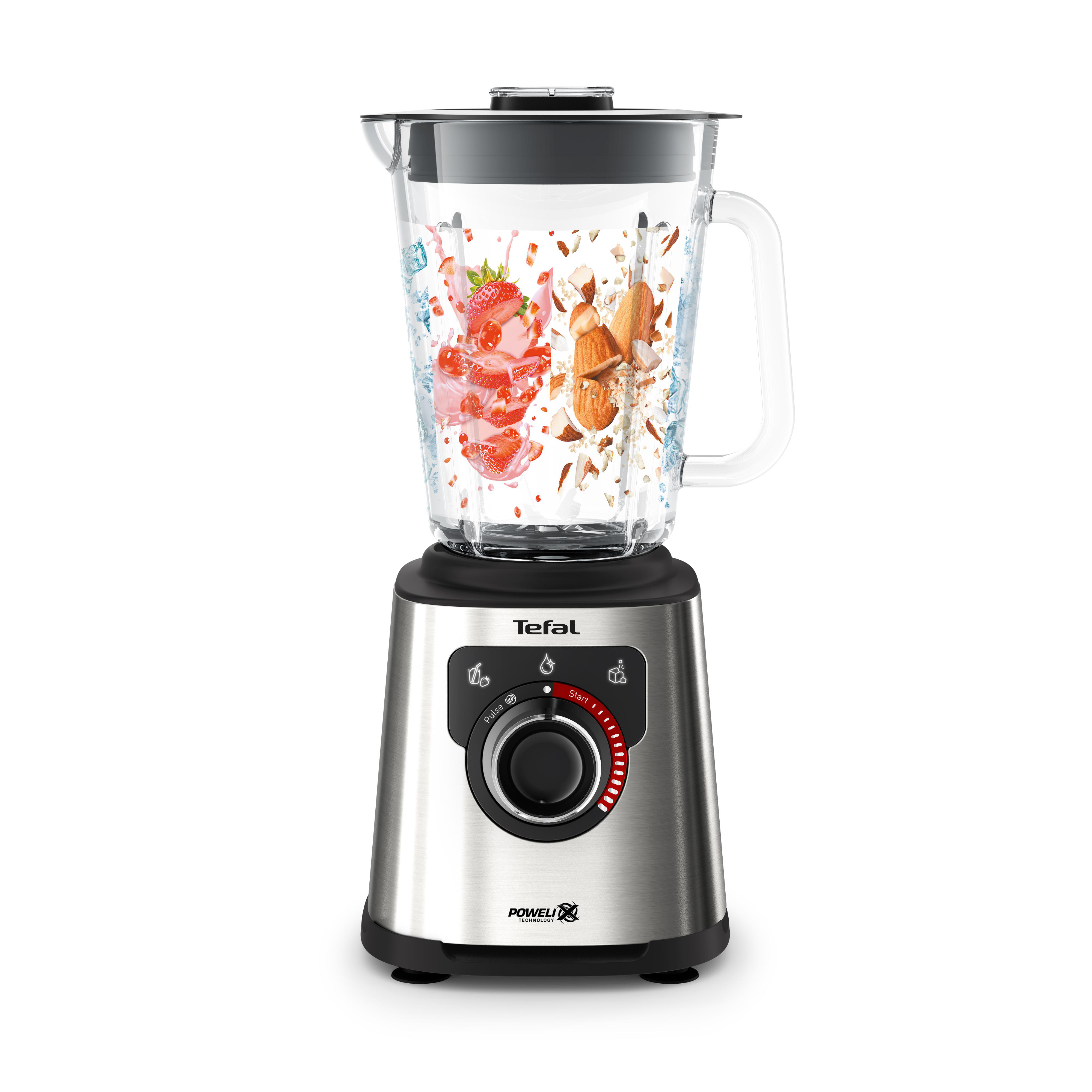 Ein Mixer mit einer Glaskaraffe, gefüllt mit Erdbeeren und Nüssen. Die Basis ist silber.