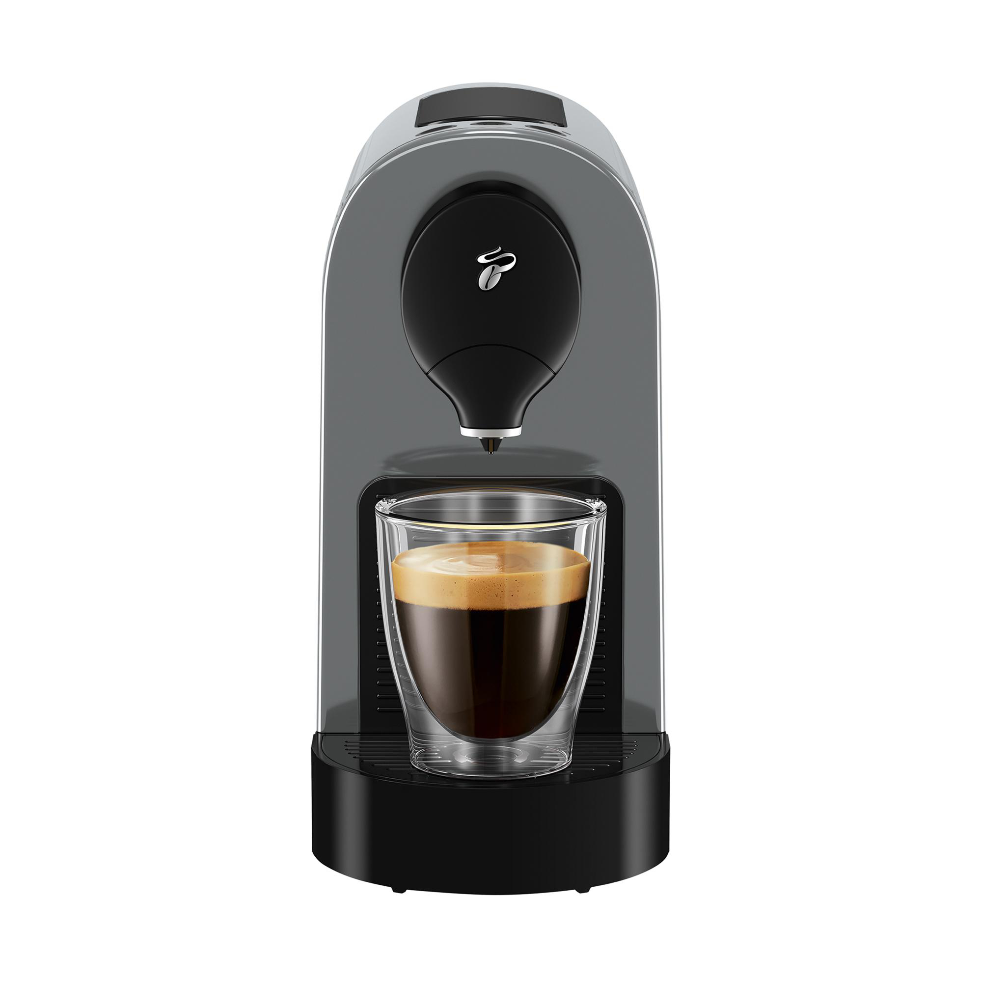 Kaffeemaschine mit doppelwandiger Glastasse, gefüllt mit Kaffee.