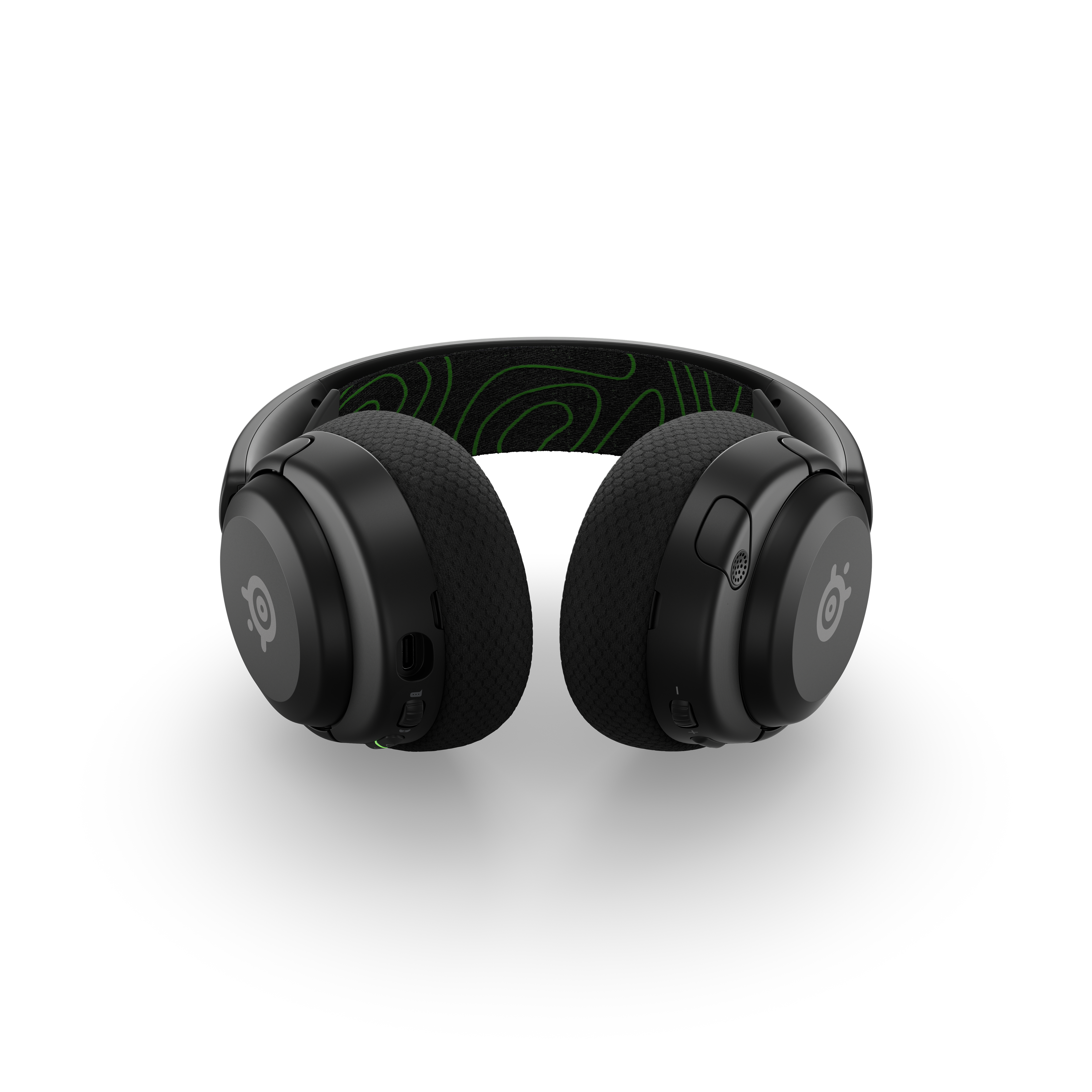 Schwarze kabellose Kopfhörer, Draufsicht. Die Ohrmuscheln sind rund, mit grünem Design am Kopfband.