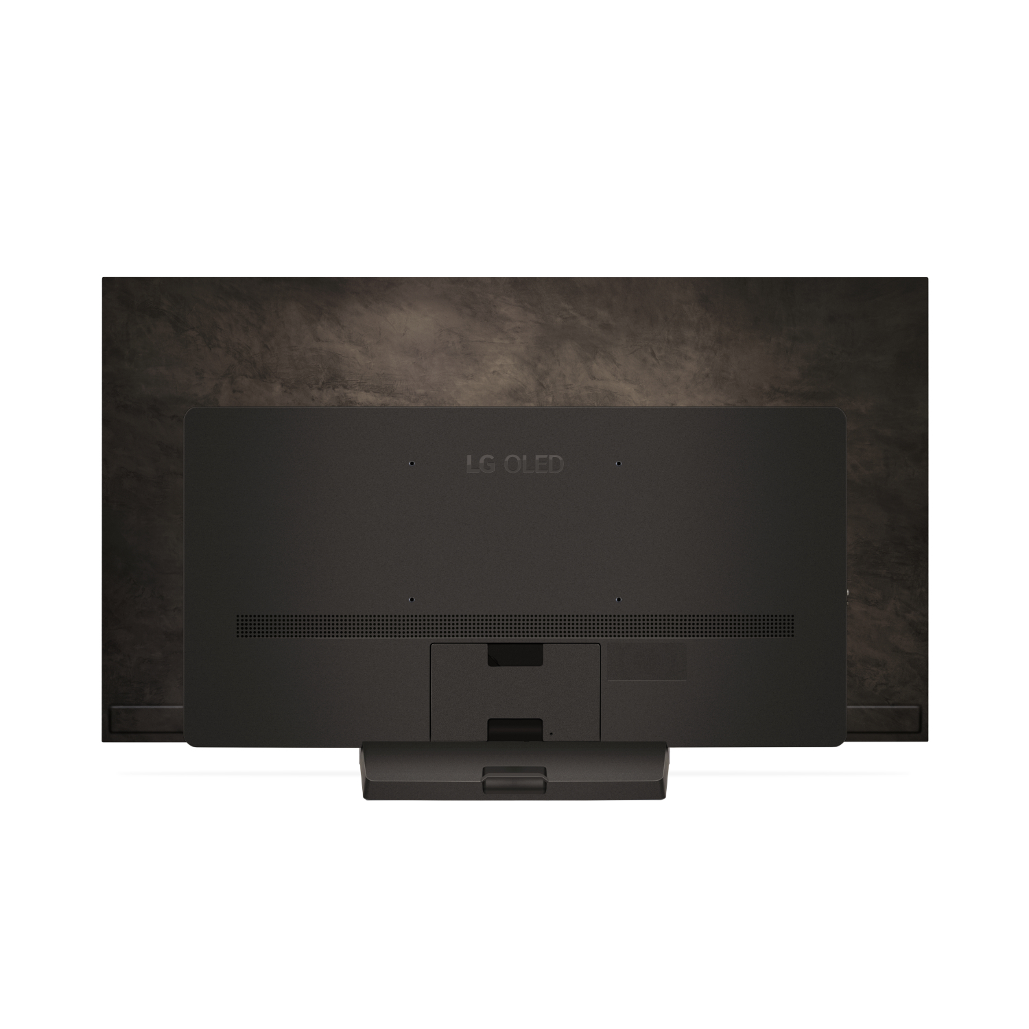 L'arrière d'un téléviseur LG OLED noir, avec le logo LG OLED visible, contre un mur marron texturé.