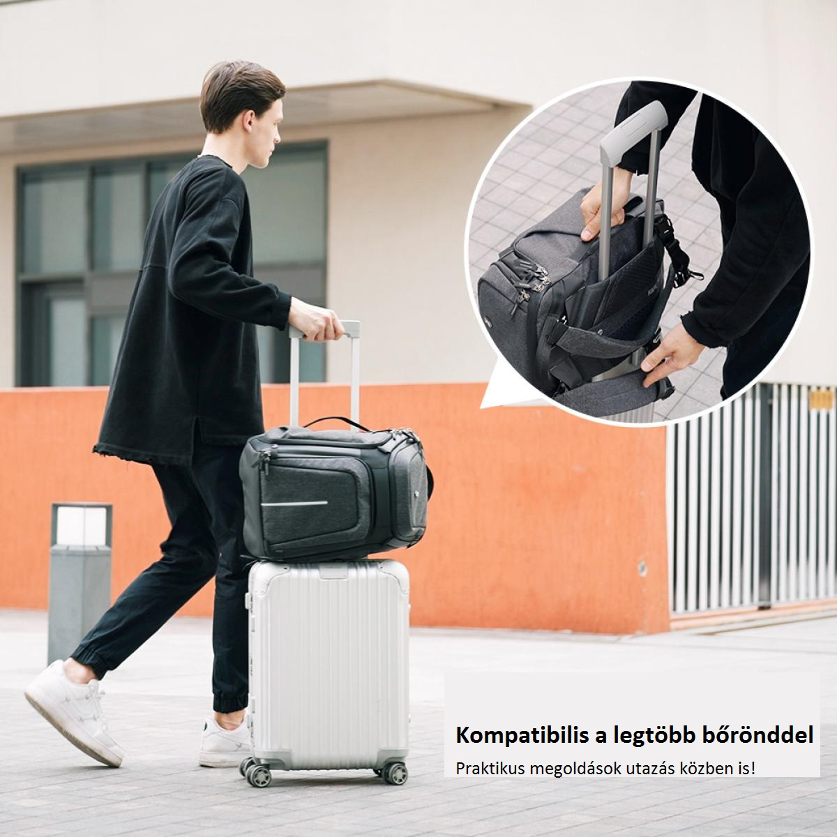 Egy személy, aki poggyásszal sétál, egy gurulós bőrönddel és egy táskával a tetején.