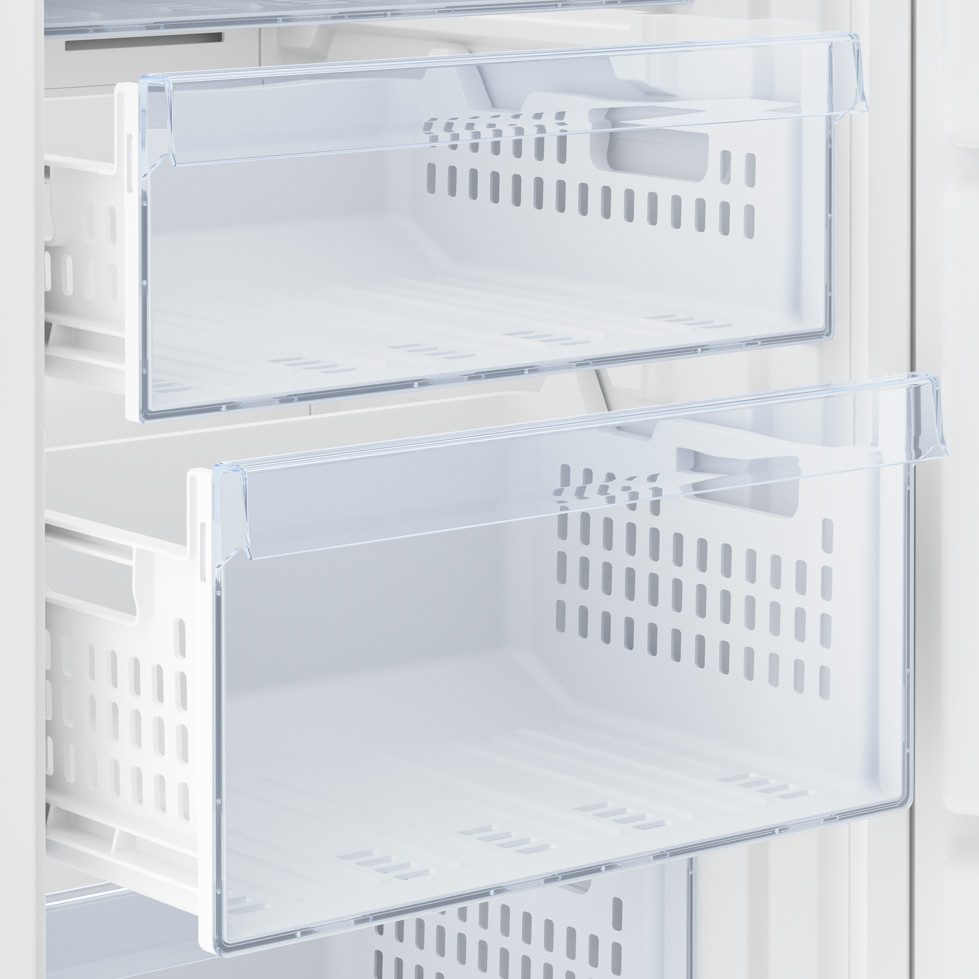 Dos cajones blancos de congelador. Frentes transparentes, abiertos. Interior de un refrigerador.