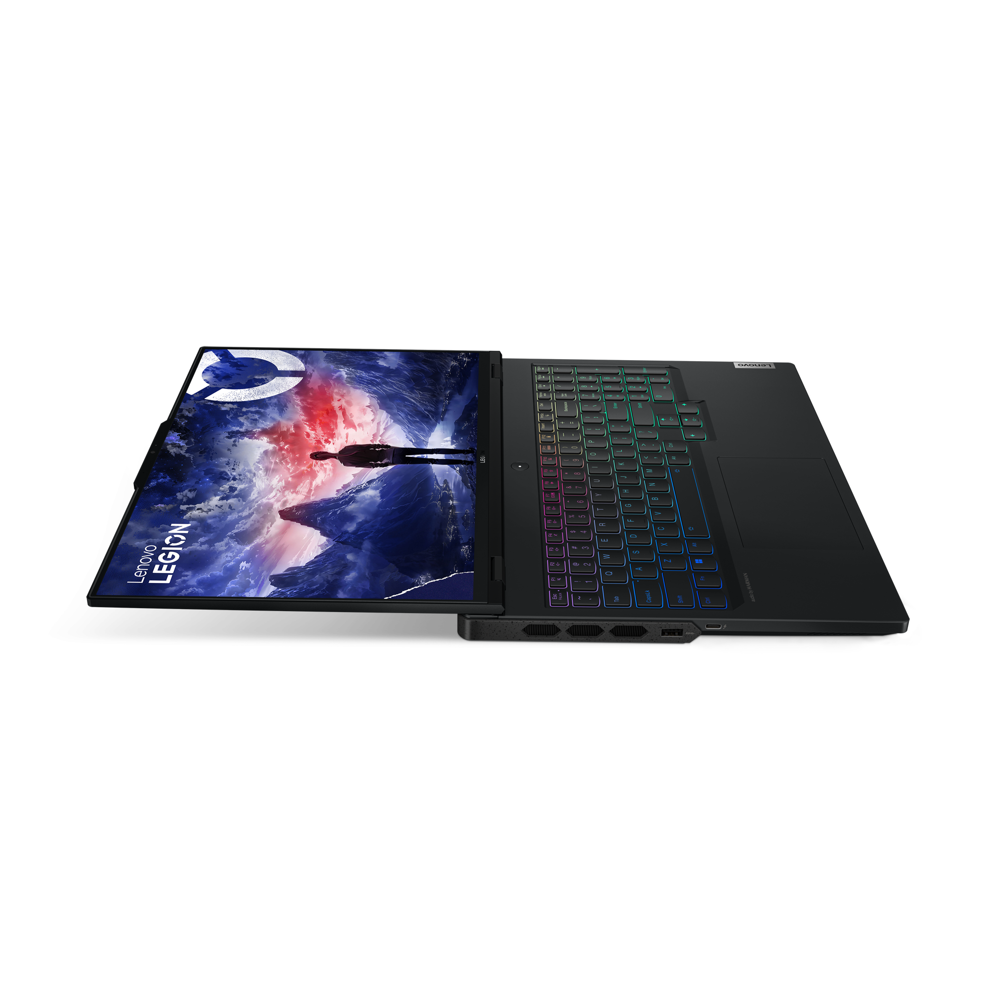 Siyah Lenovo dizüstü bilgisayar. Ekran fütüristik bir sahne gösteriyor. Klavye renklerle aydınlatılıyor.