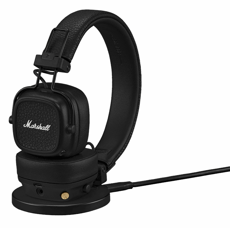 Czarne słuchawki Marshall na stacji ładującej z kablem. Widoczna lewa słuchawka.