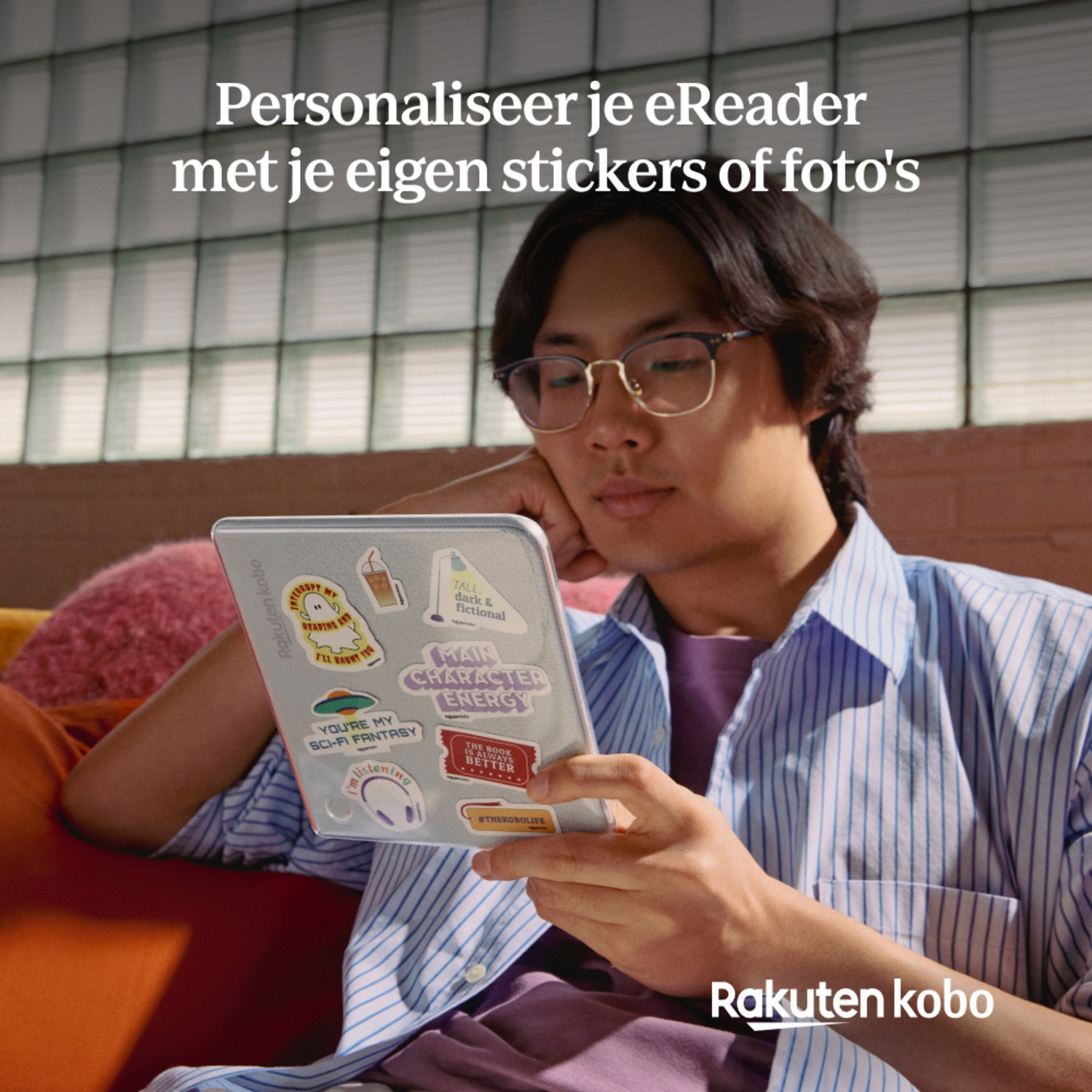 Man using a sticker-covered eReader. The eReader is on a table. Text says personalize your eReader.