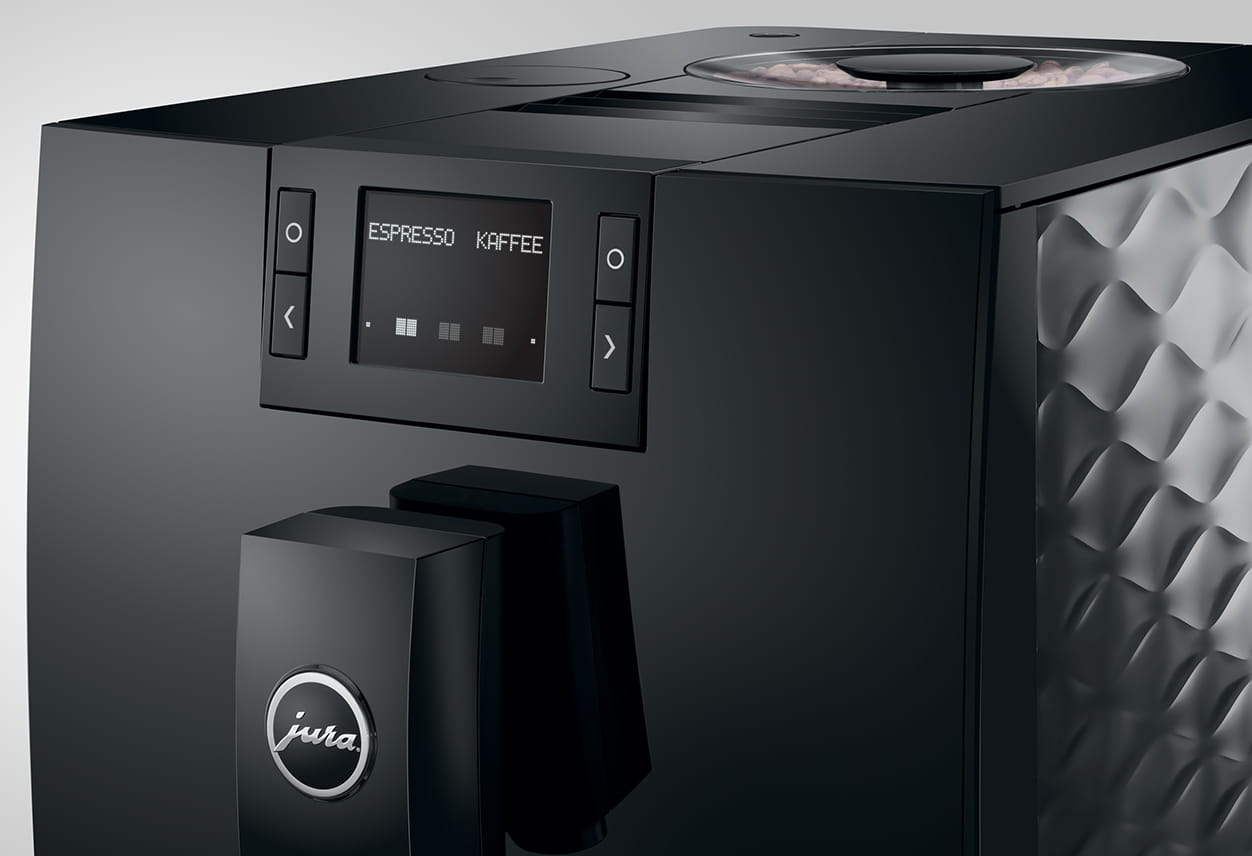 Macchina da caffè Jura nera con schermo che mostra 'ESPRESSO KAFFEE', vista ravvicinata.