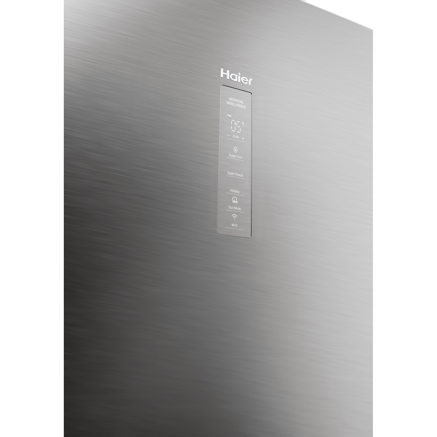 Close-up of a silver refrigerator door with Haier logo and control panel.