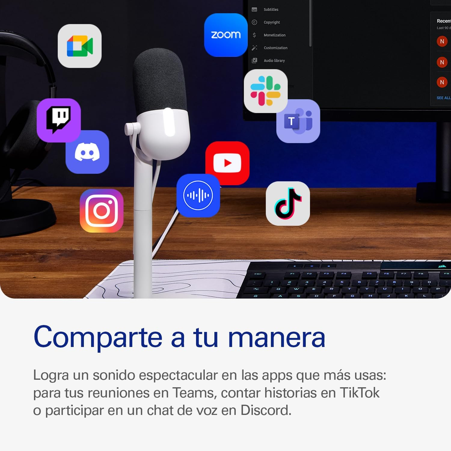 Un micrófono con iconos de aplicaciones en un escritorio de madera.