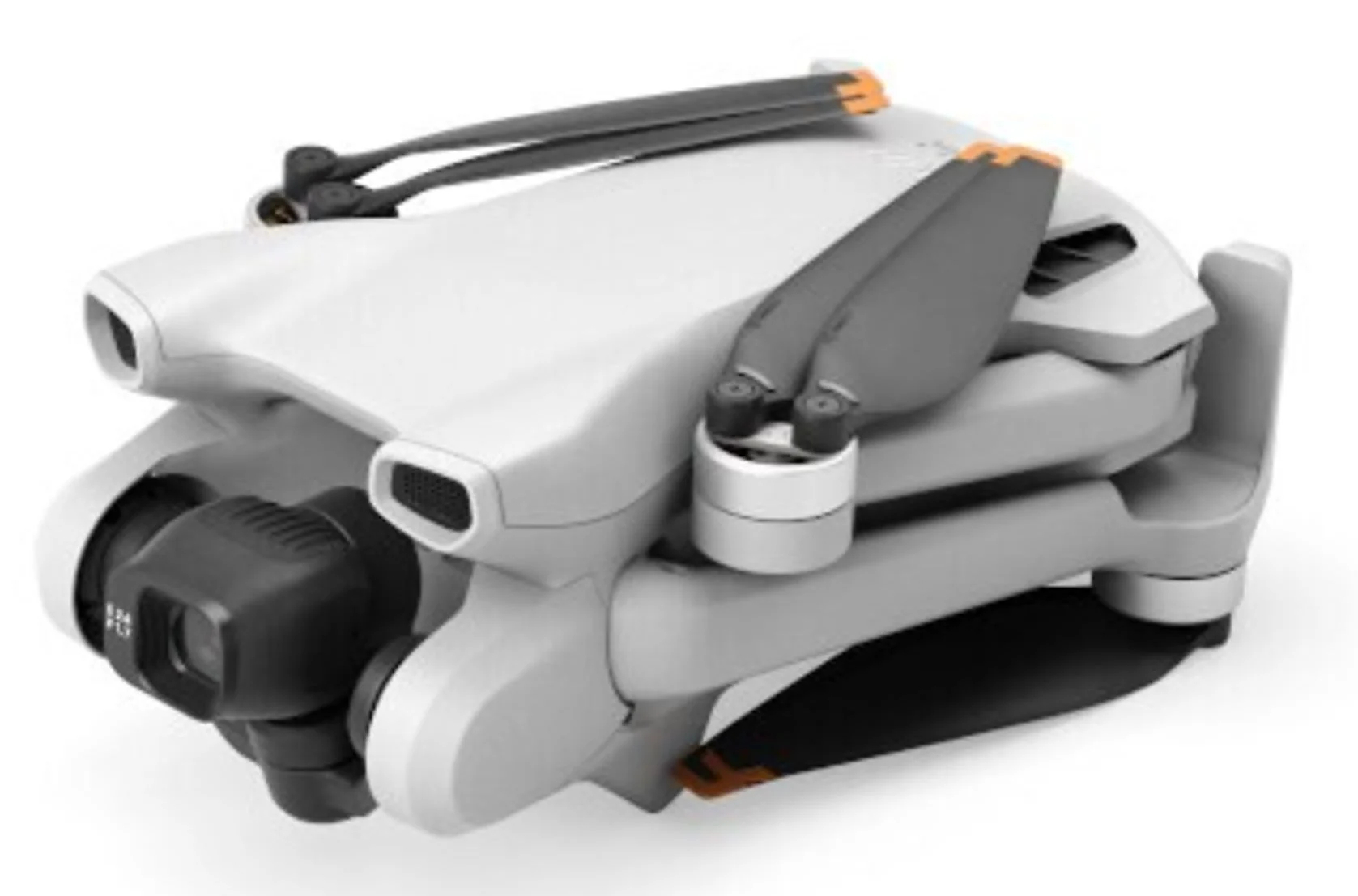Biały złożony dron z szarymi śmigłami i czarną kamerą. Widoczne pomarańczowe akcenty. Białe tło.