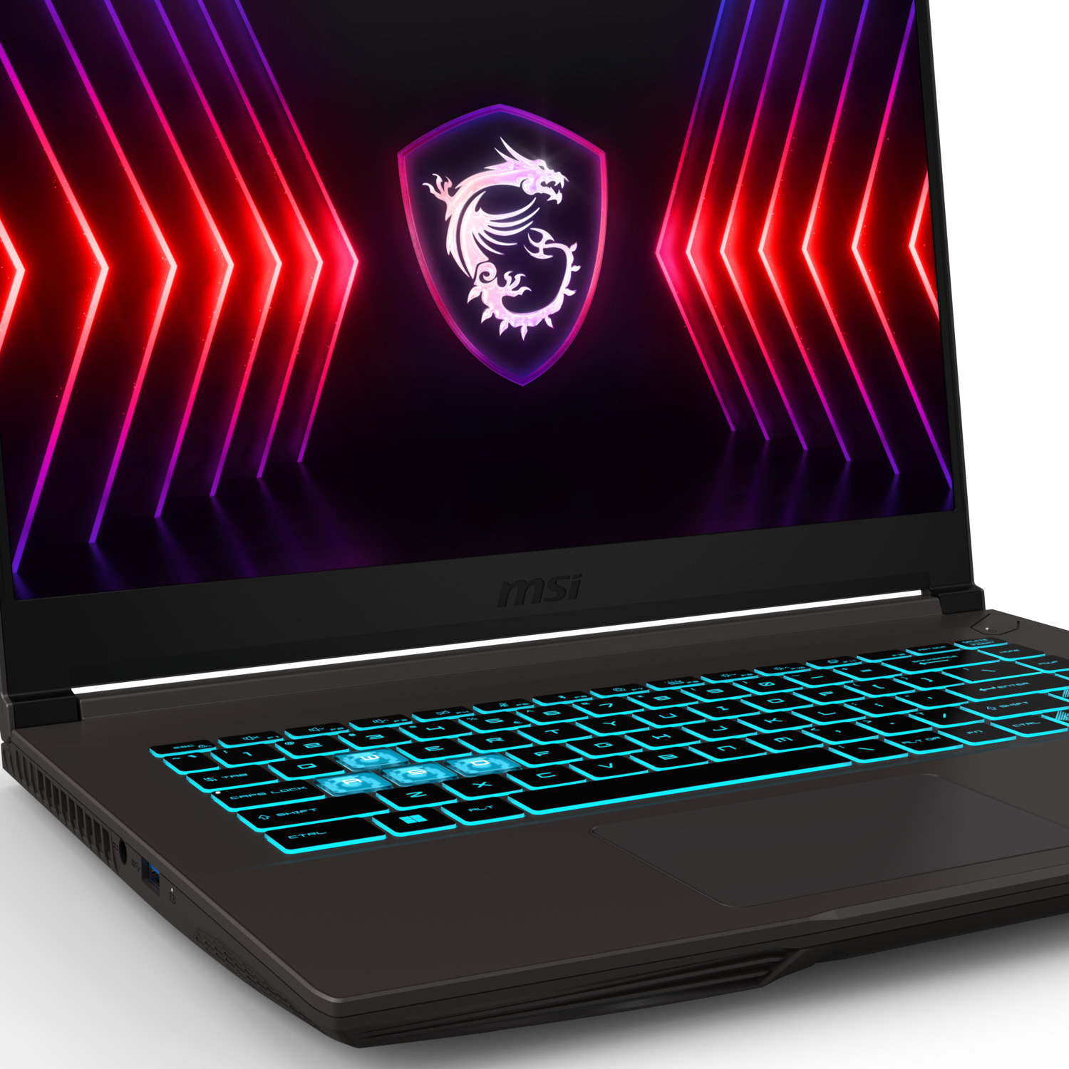 Ordinateur portable de jeu avec clavier éclairé et écran affichant un logo avec des néons. Corps noir et lumières bleues.