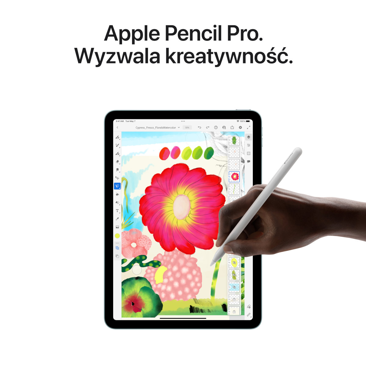 iPad z rysunkiem kolorowego kwiatu, rysowanym białym Apple Pencil.